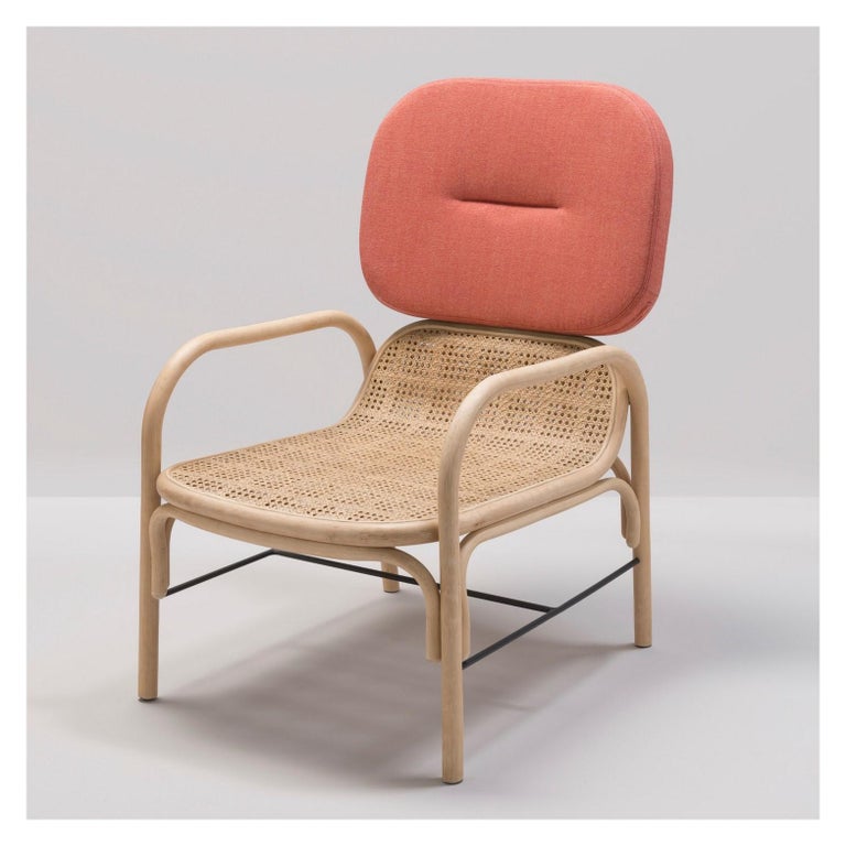 Combining modernity and tradition, design lines, graphic and timelessness this lounger chair is composed of a robust curved rattan and airy structure, a wicker cane seat and a soft fabric adorning the comfy headrest. (Available in different color).