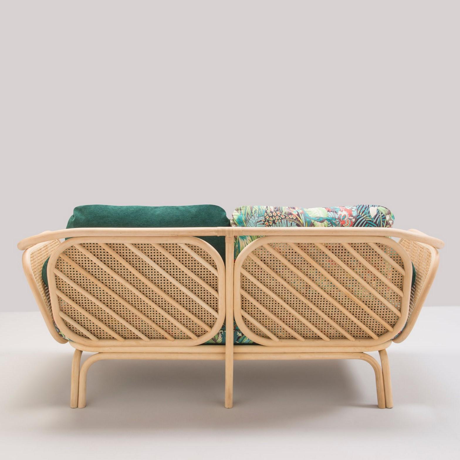 Timeless and airy lines, trendy and graphic design for this French sofa composed of a robust rattan structure anorned with cane windows and gorgeous fabric (new item, never used).
