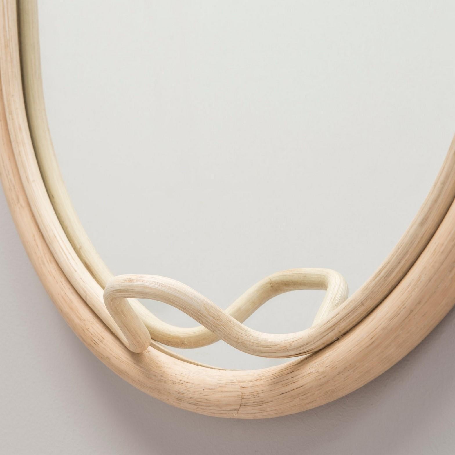 Wall mirror, French design and work of a great fineness in natural fiber with an integrated coat hook. New item, never used.