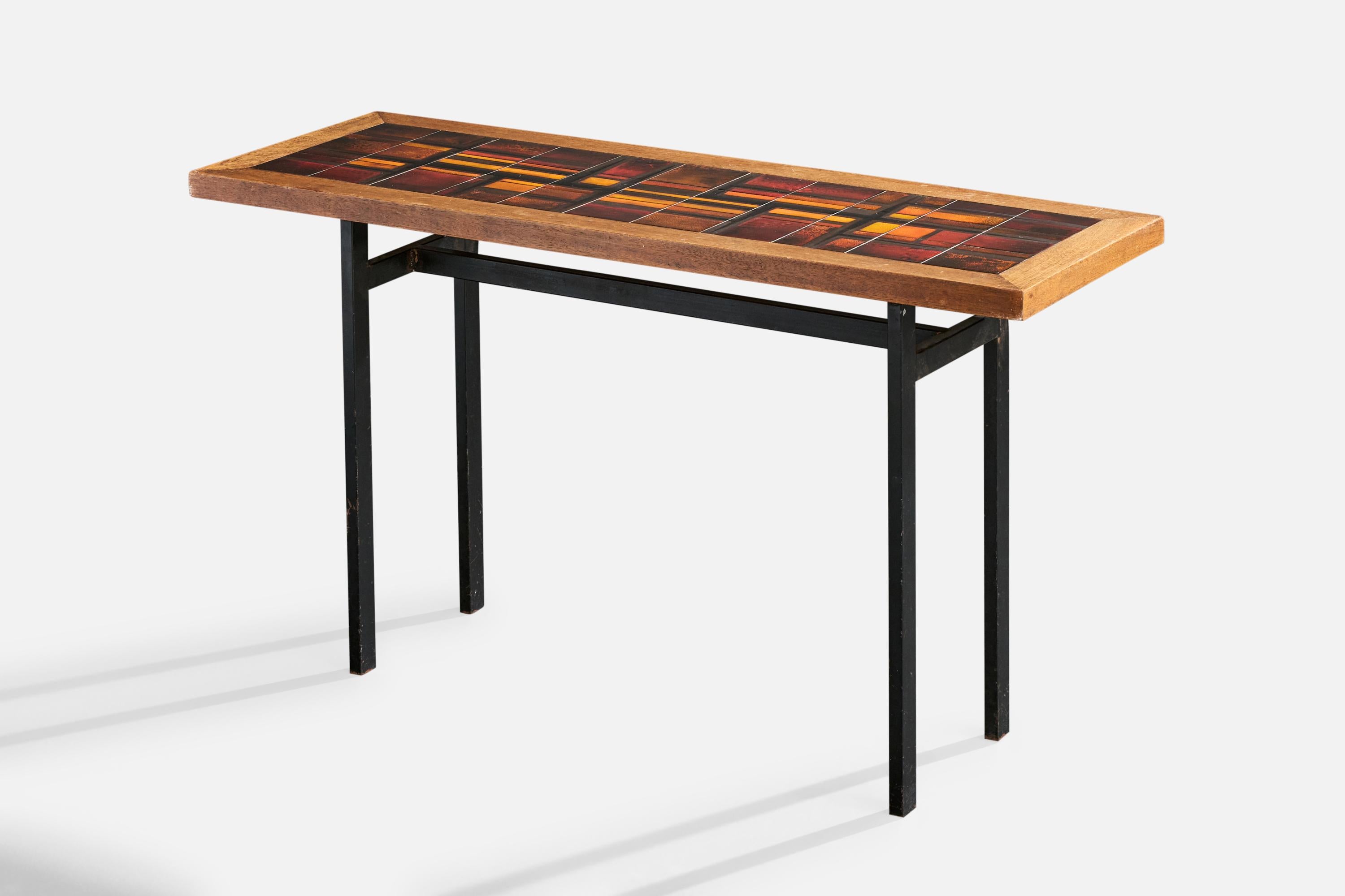 A black-lacquered metal, wood and red, orange, yellow glazed ceramic tile console table designed and produced in France, c. 1970s.

Overall Dimensions (inches): 28.4
