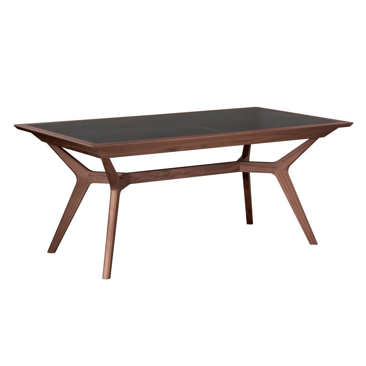 This extensible dining table is proposed in solid walnut wood for the feet and structure.
Table top is a 3mm dark gray, with brown stains, 