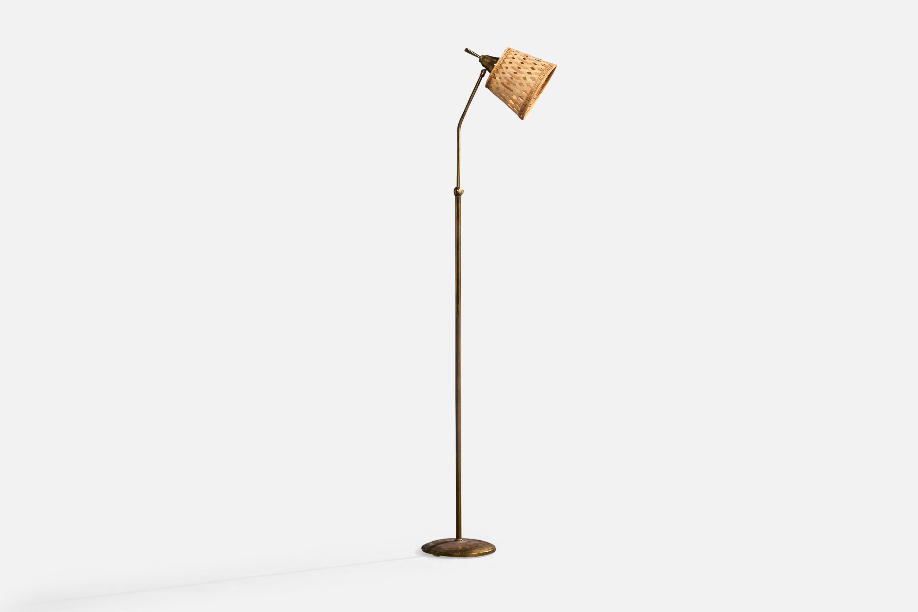 Lámpara de pie regulable de latón y ratán, diseñada y fabricada en Francia, c. 1950.

Dimensiones de la lámpara (pulgadas): 60,0 