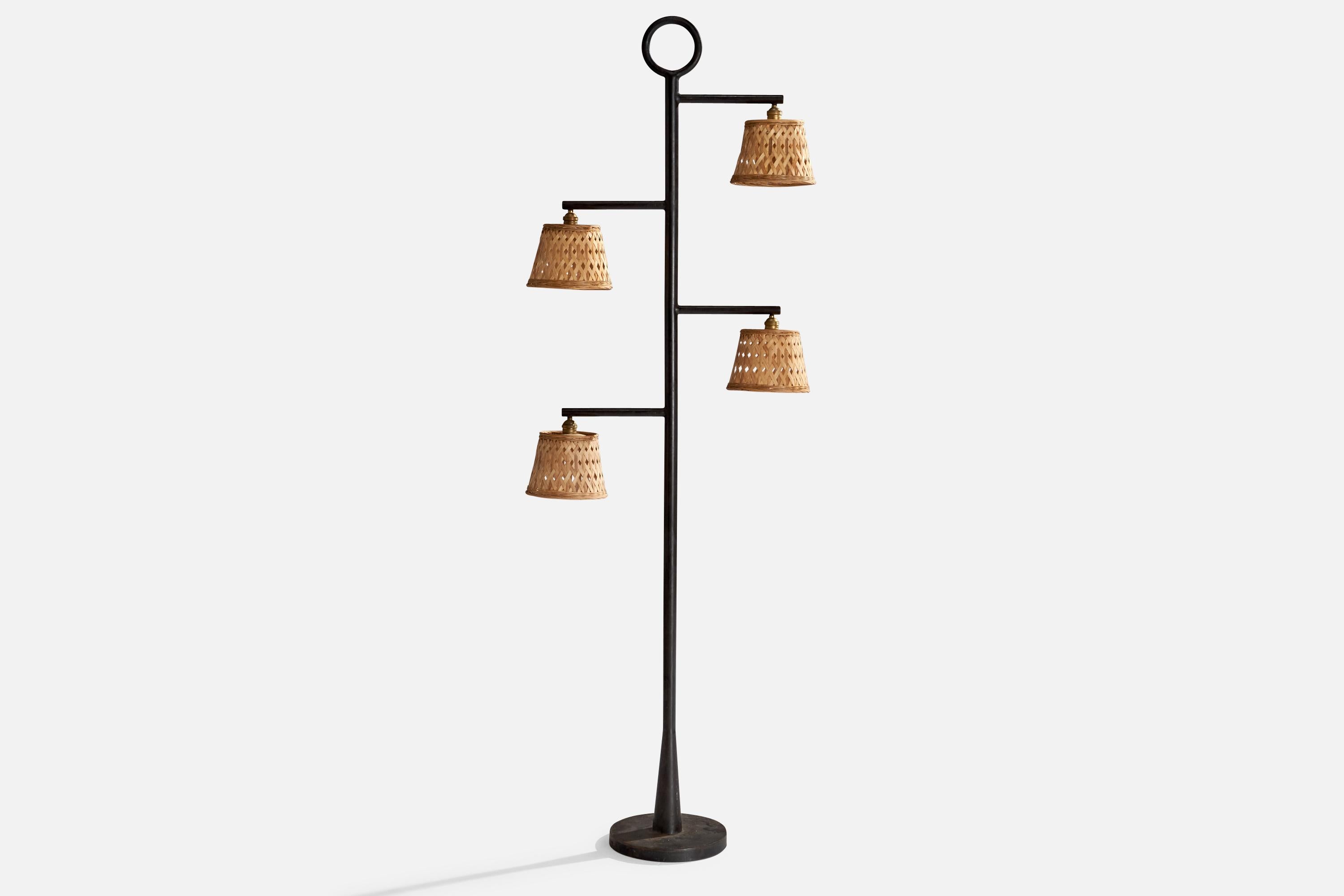 A black-lacquered metal, brass and rattan floor lamp designed and produced in France, c. 1970s.

Dimensions of Lamp (inches): 80” H x 28” W x 8” D 

Bulb Specifications: E-26 

Number of Sockets (per fixture): 4

Sold with lampshades.

All lighting