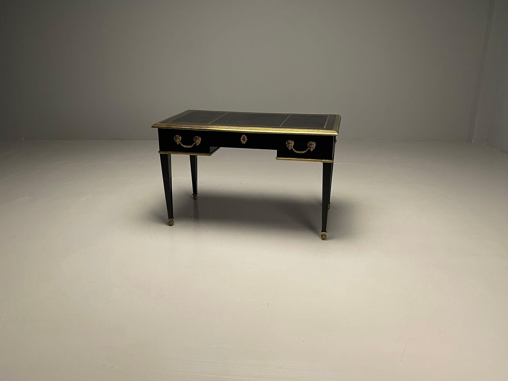 Hollywood Regency Desks, Maison Jansen Attributed, Ebonized, Bronze, Refinished.

A Compatible pair of Hollywood Regency desks in Maison Jansen manner. Two French ebony based leather top bronze-mounted desks in the manner of Maison Jansen. Each with