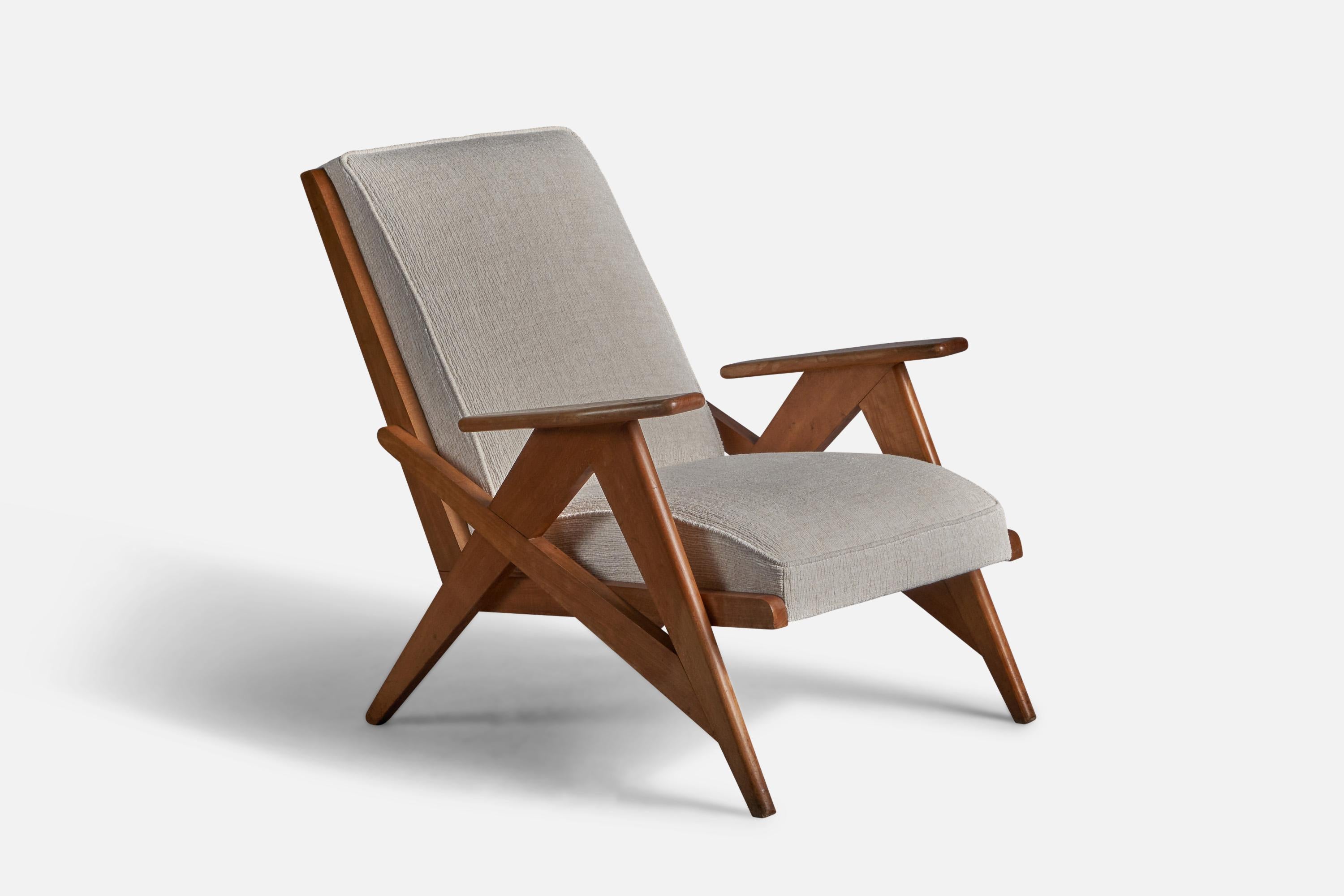 A oak and white fabric lounge chair, designed and produced in France, 1950s.
15
