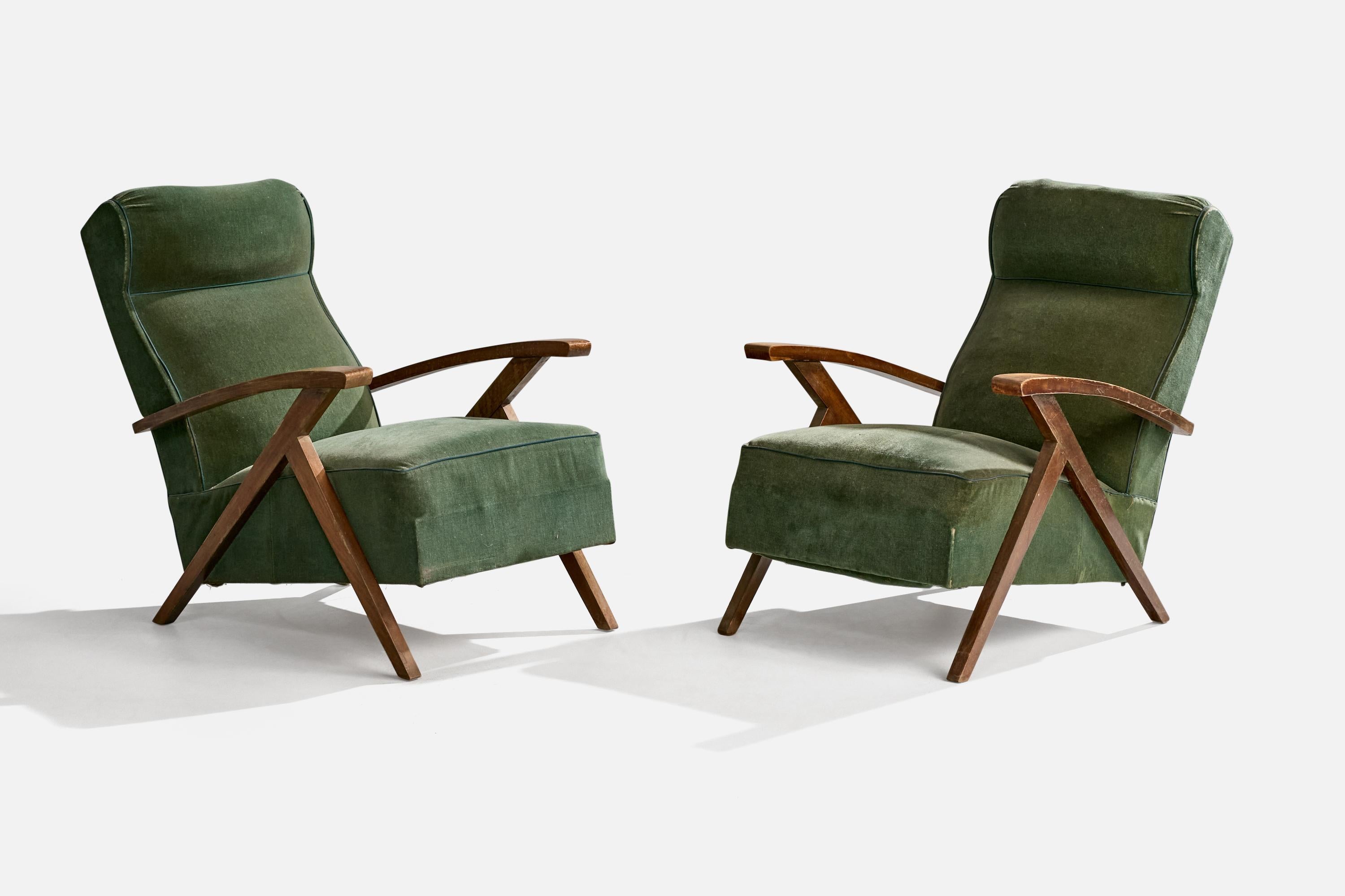 A pair of wood and green velvet fabric lounge chairs designed and produced in France, c. 1950s.

Overall Dimensions (inches): 33.25