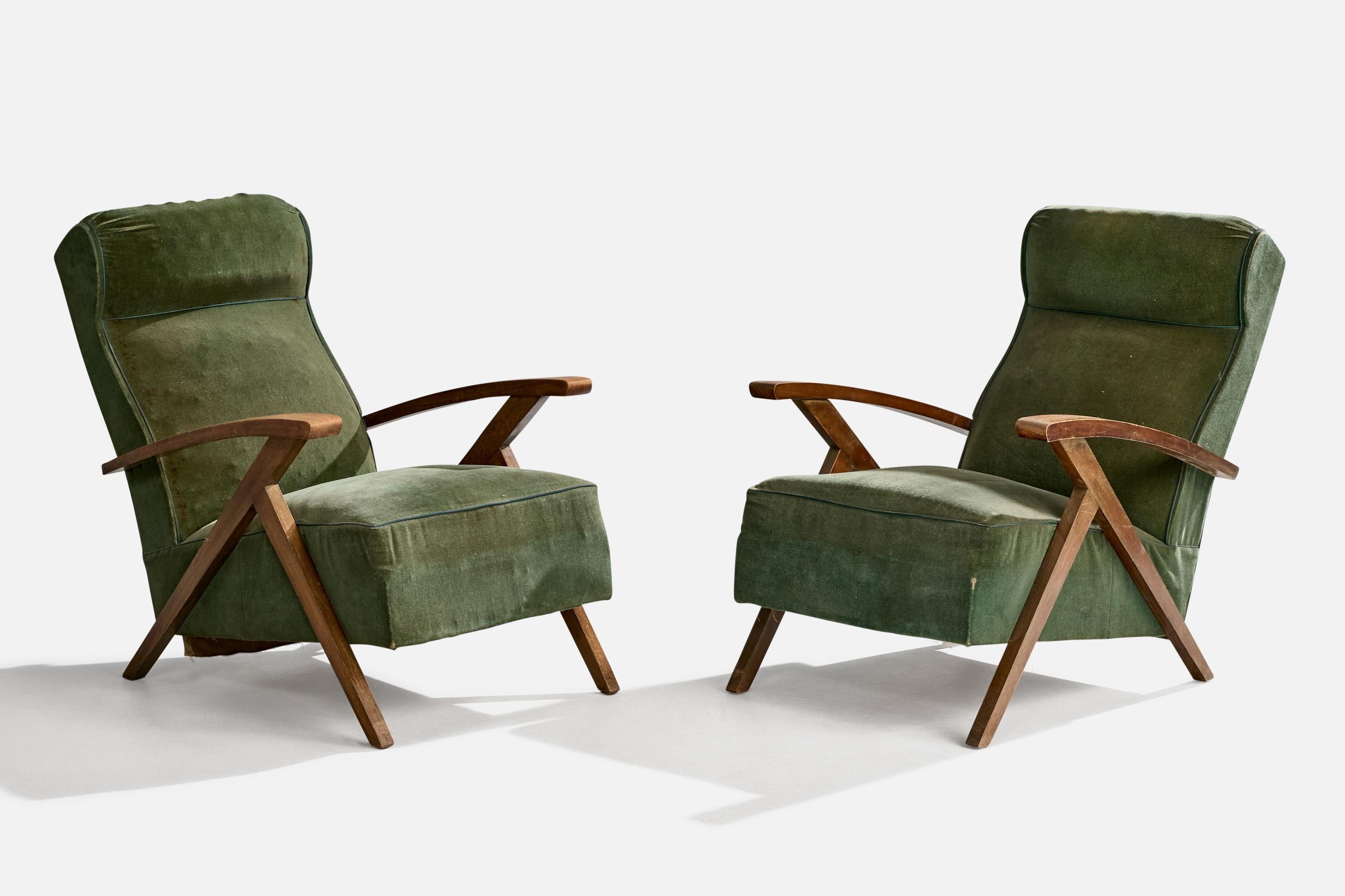 A pair of wood and green velvet fabric lounge chairs designed and produced in France, c. 1950s.

Overall Dimensions (inches): 33.25