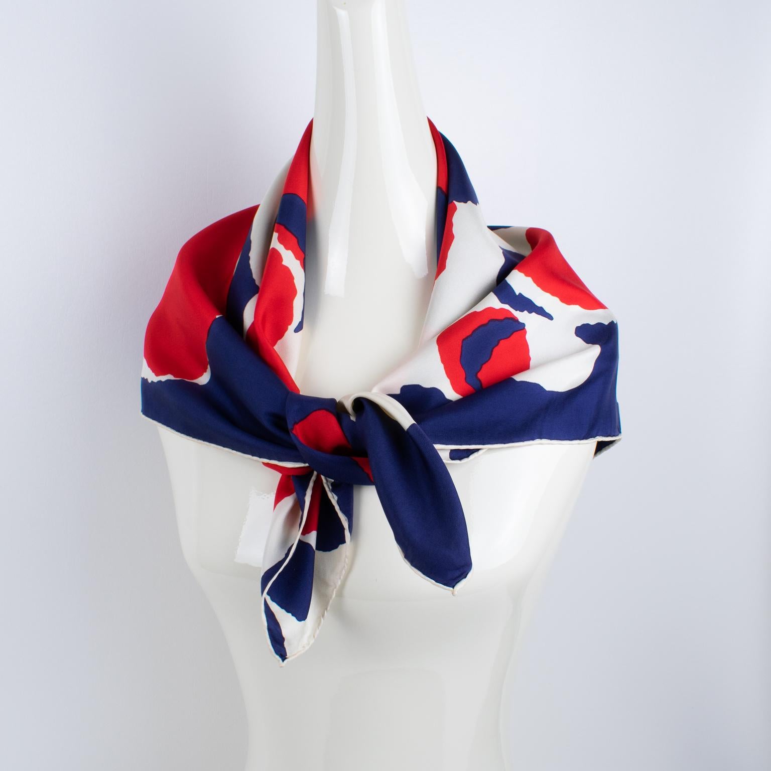 French fashion designer Maggy Rouff (1896 - 1971) Paris designed this elegant 100% pure silk scarf in the 1960s. This scarf features a stylized abstract design with graduated bubbles. The Maggy Rouff's signature name is on the lower right corner.