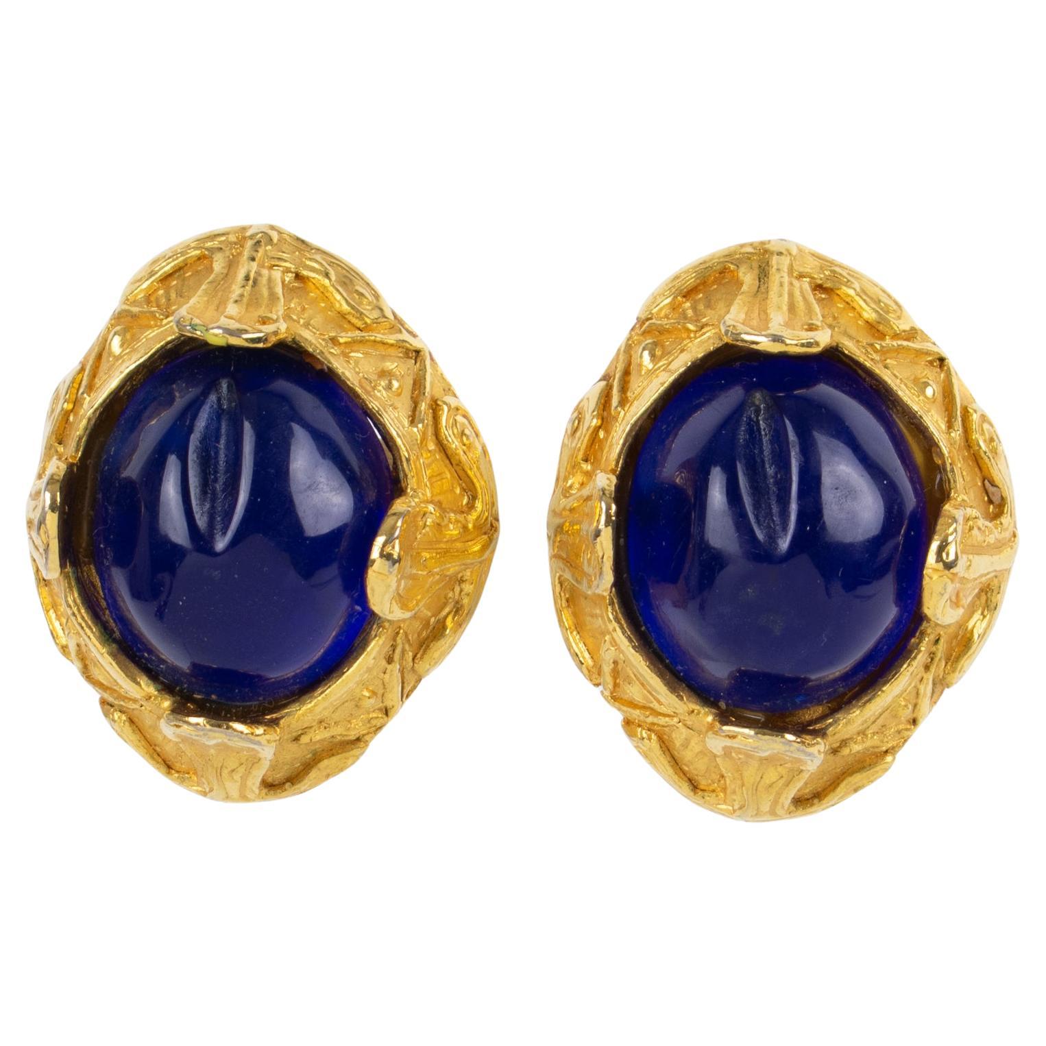French Designer MCL Gilt Metal Clip Earrings with Blue Cabochons For Sale