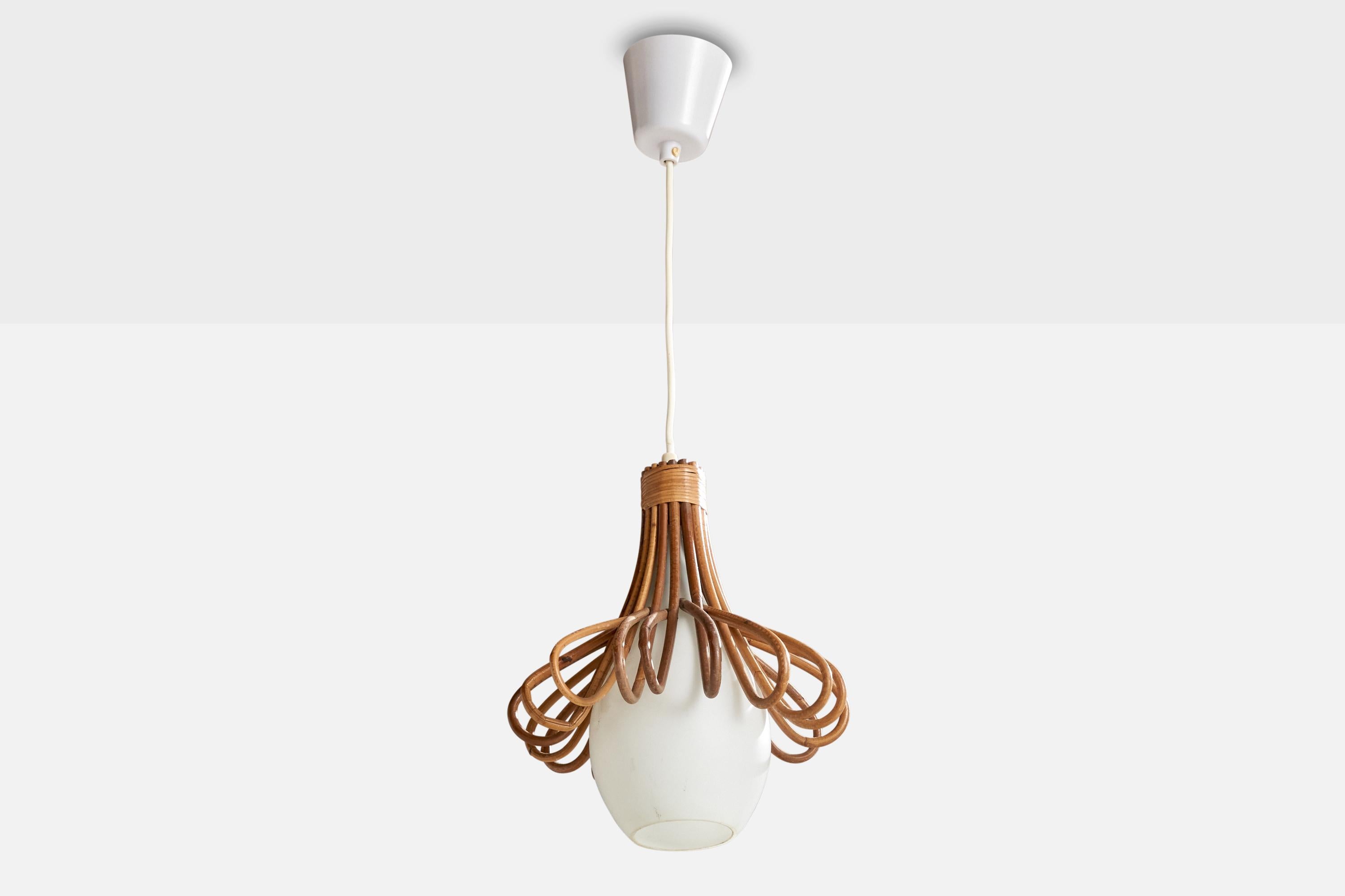 An opaline glass and rattan pendant light designed and produced in France, c. 1960s.

Overall Dimensions (inches): 11.25” H x  9” Diameter
Bulb Specifications: Bayonet Bulbs
Number of Sockets: 1

All lighting will be converted for US usage. We are