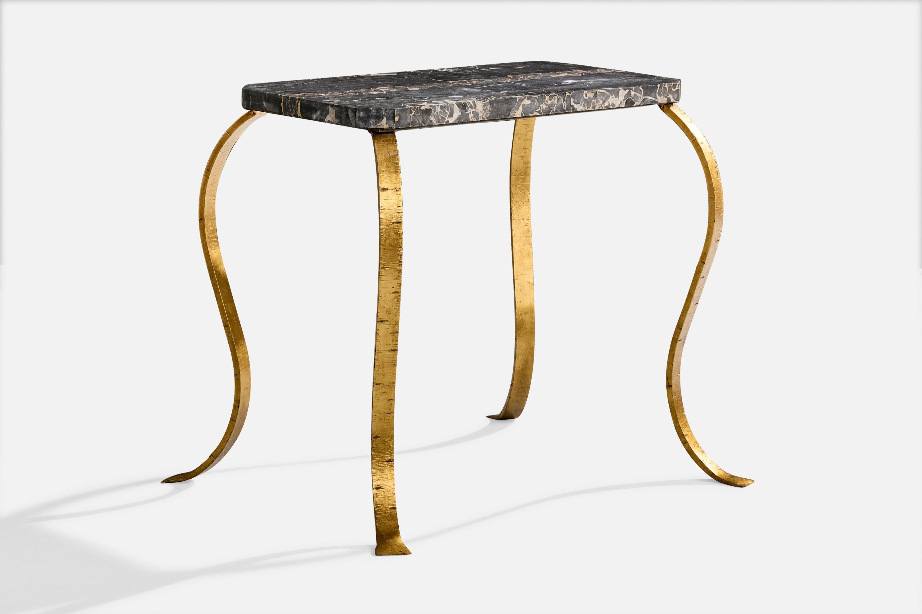 A gilded iron and marble side table designed and produced in France, c. 1940s.

Brass base presents with light wear consistent with age and use

Overall Dimensions (inches): 26.25