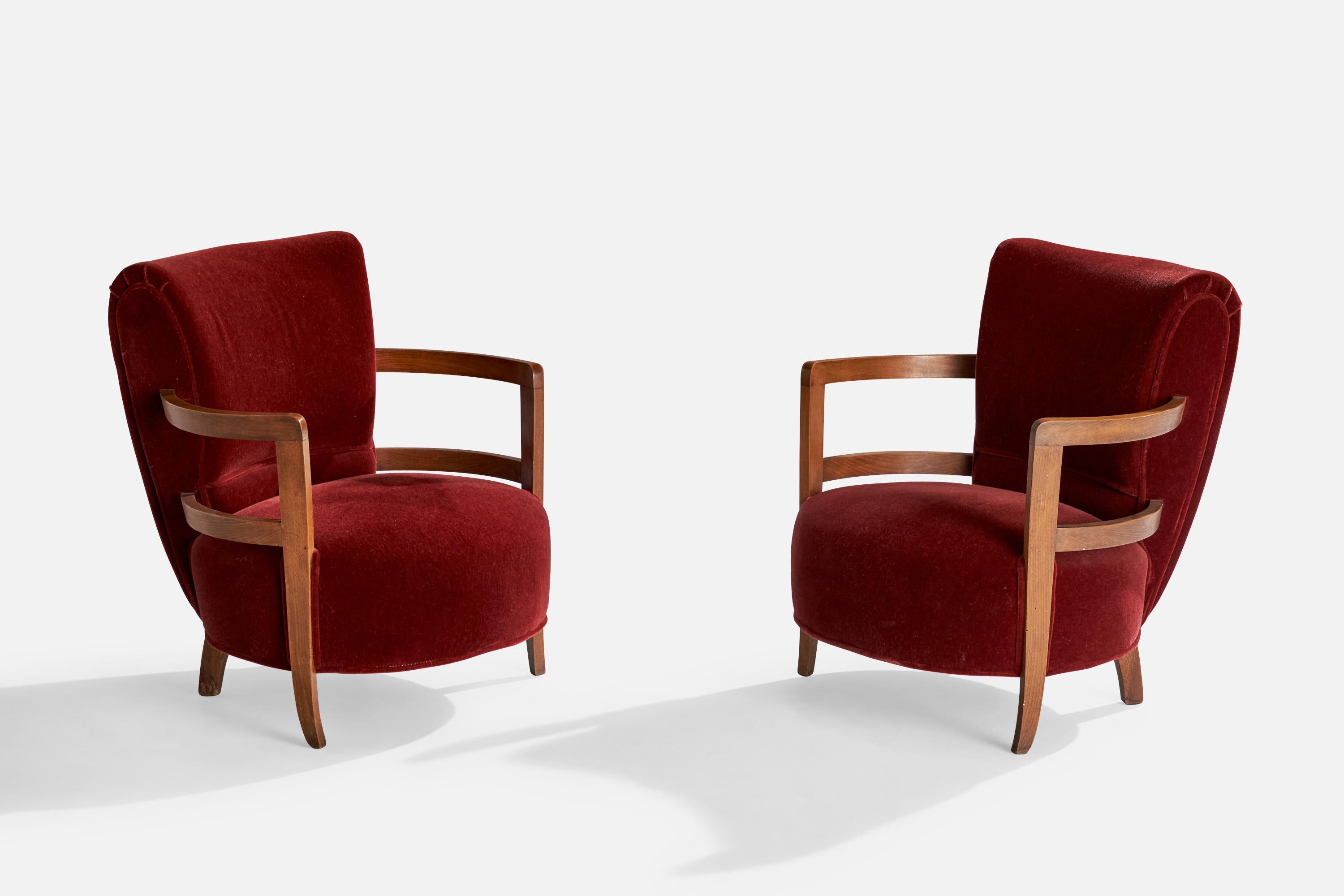 A pair of very small oak and red velvet lounge chairs designed and produced in France, c. 1930s.

Dimensions: 27” H x 24.125” W x 25” D

Seat height: 13” H