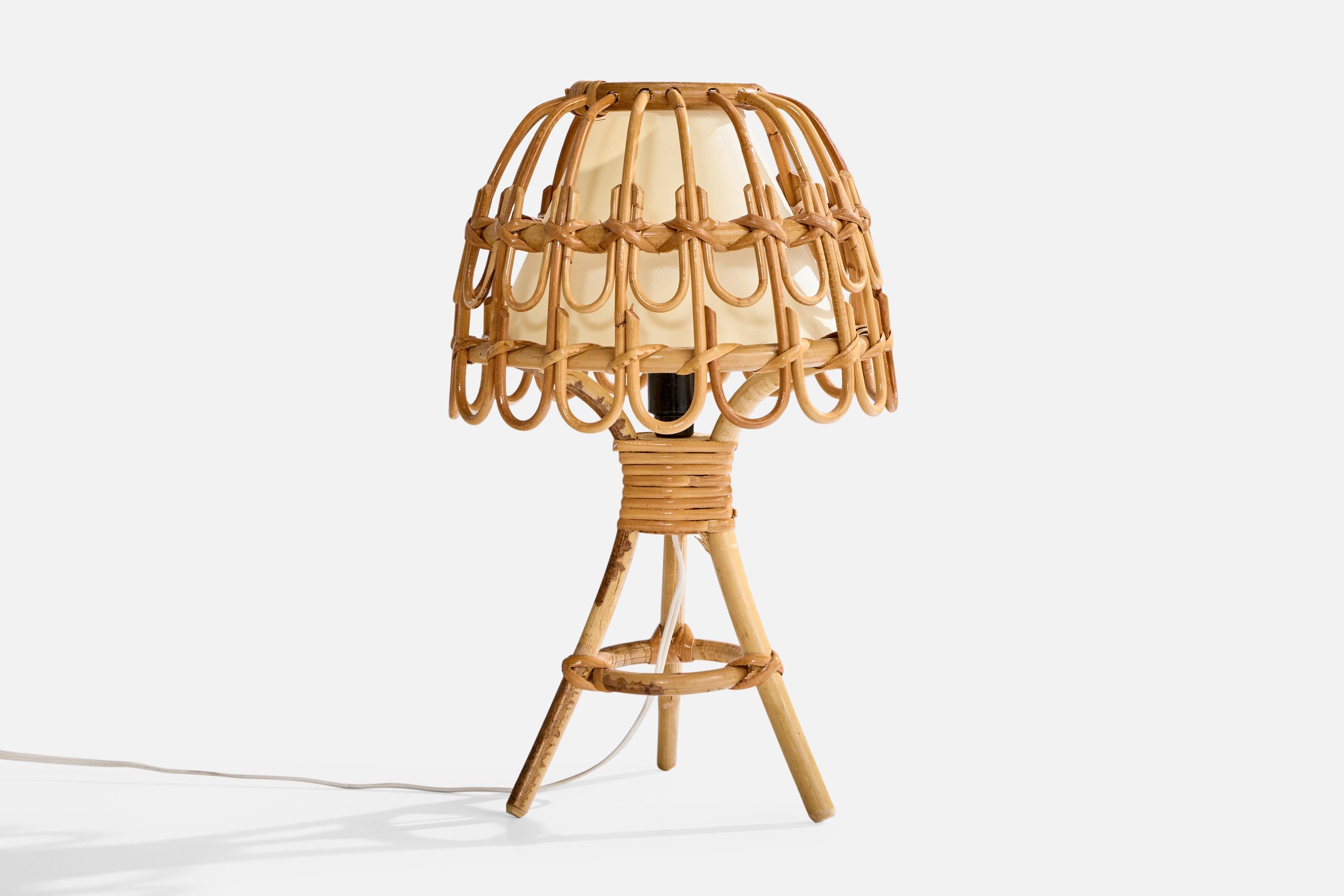 A bamboo, rattan and off-white paper table lamp designed and produced in France, c. 1970s.

Dimensions of Lamp with Shade (inches): 14.75