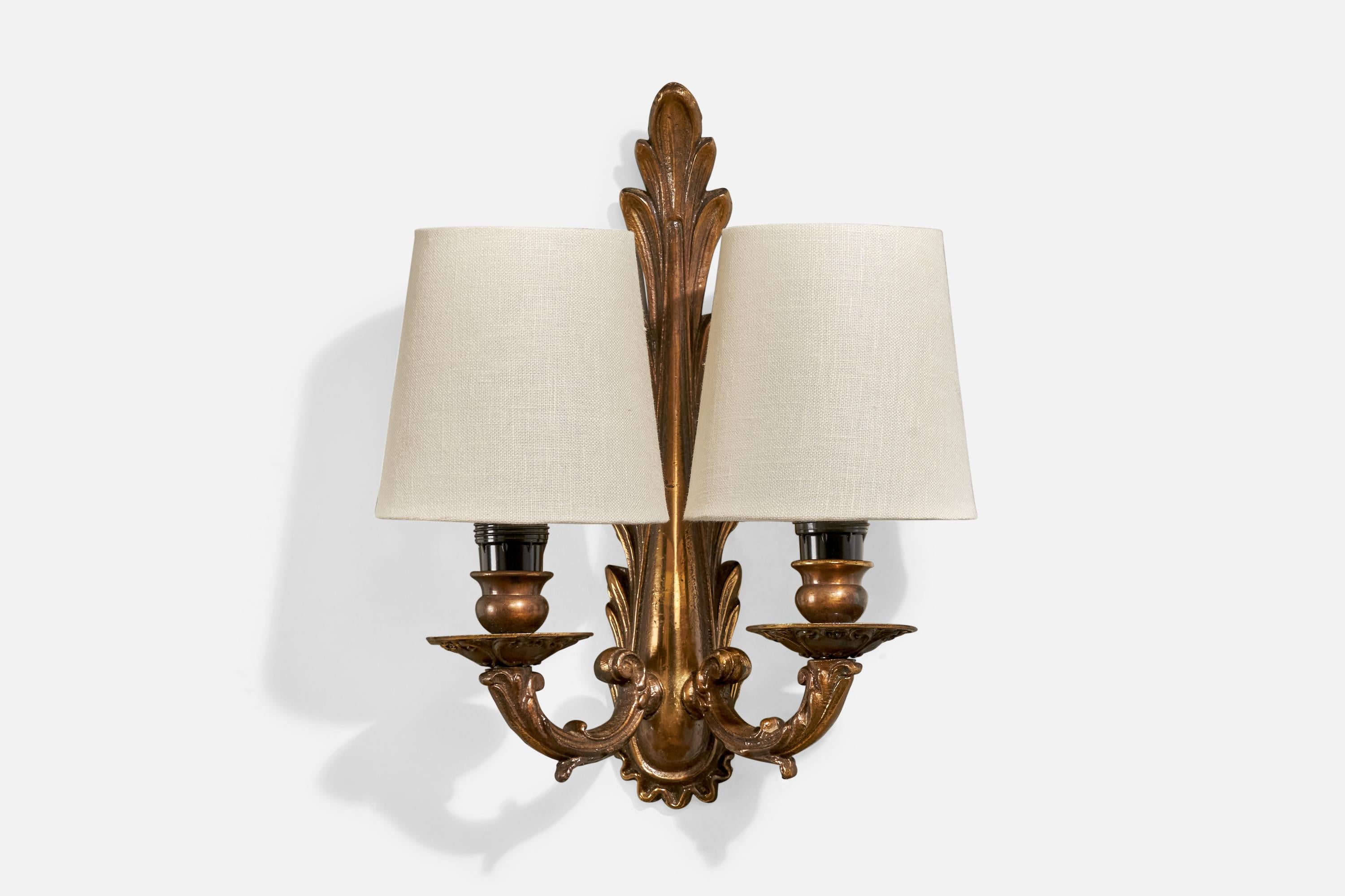 A pair of brass and fabric wall lights designed and produced in France, c. 1940s. 

Overall Dimensions (inches): 10.375” H x 9” W x 4.75“ D

Back Plate Dimensions (Inches): 4.4” H x 2” W x .5” D

Bulb Specifications: E-12

Number of Sockets (per