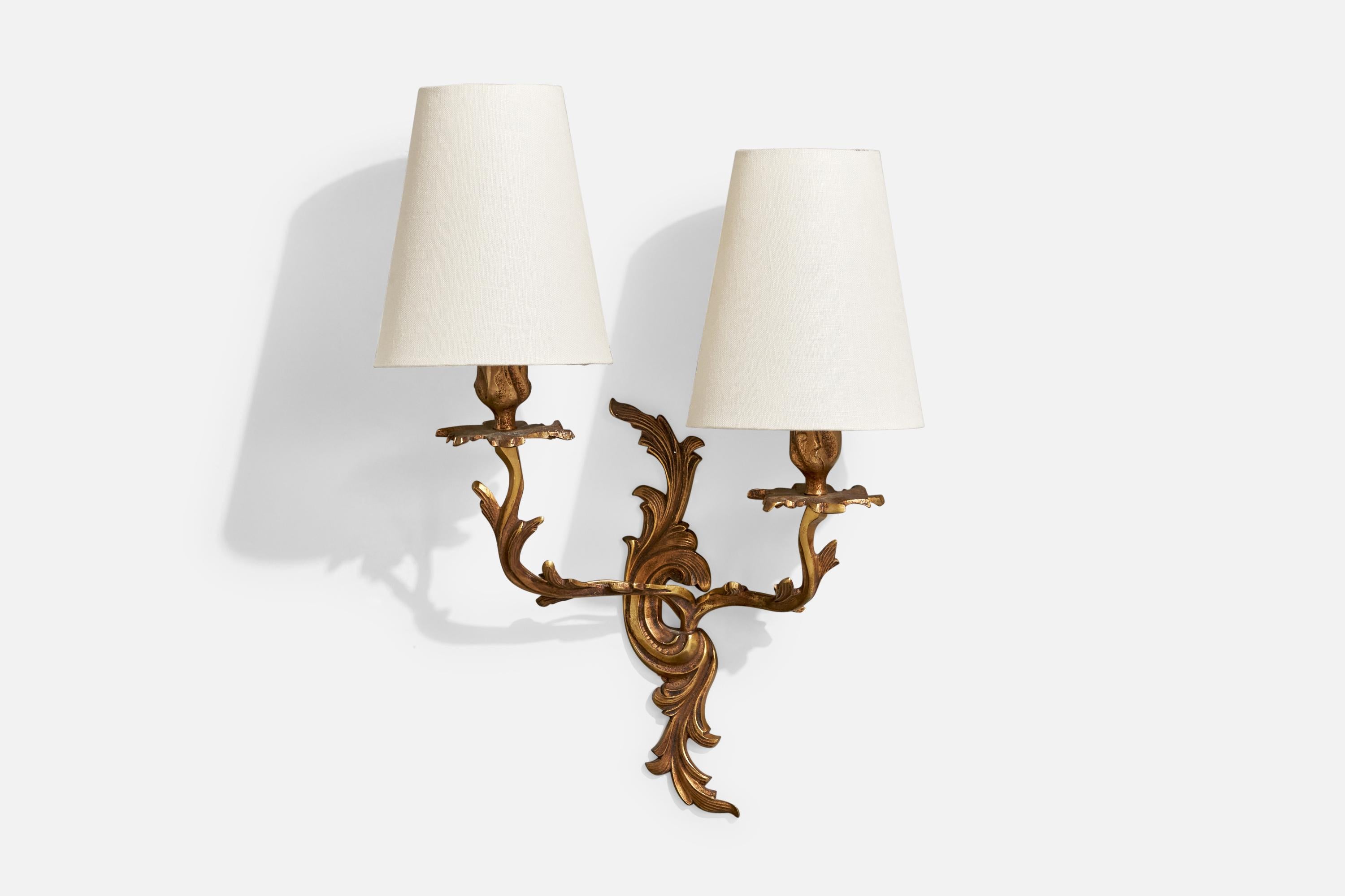 A brass and white fabric wall light designed and produced in France, c. 1940s.

Brand new lampshades.

Overall Dimensions (Inches): 17” H x 11.5” W x 6” D

Back Plate Dimensions (Inches): 9.5” H x 2“ W x .75” D

Bulb Specifications: E-12

Number of