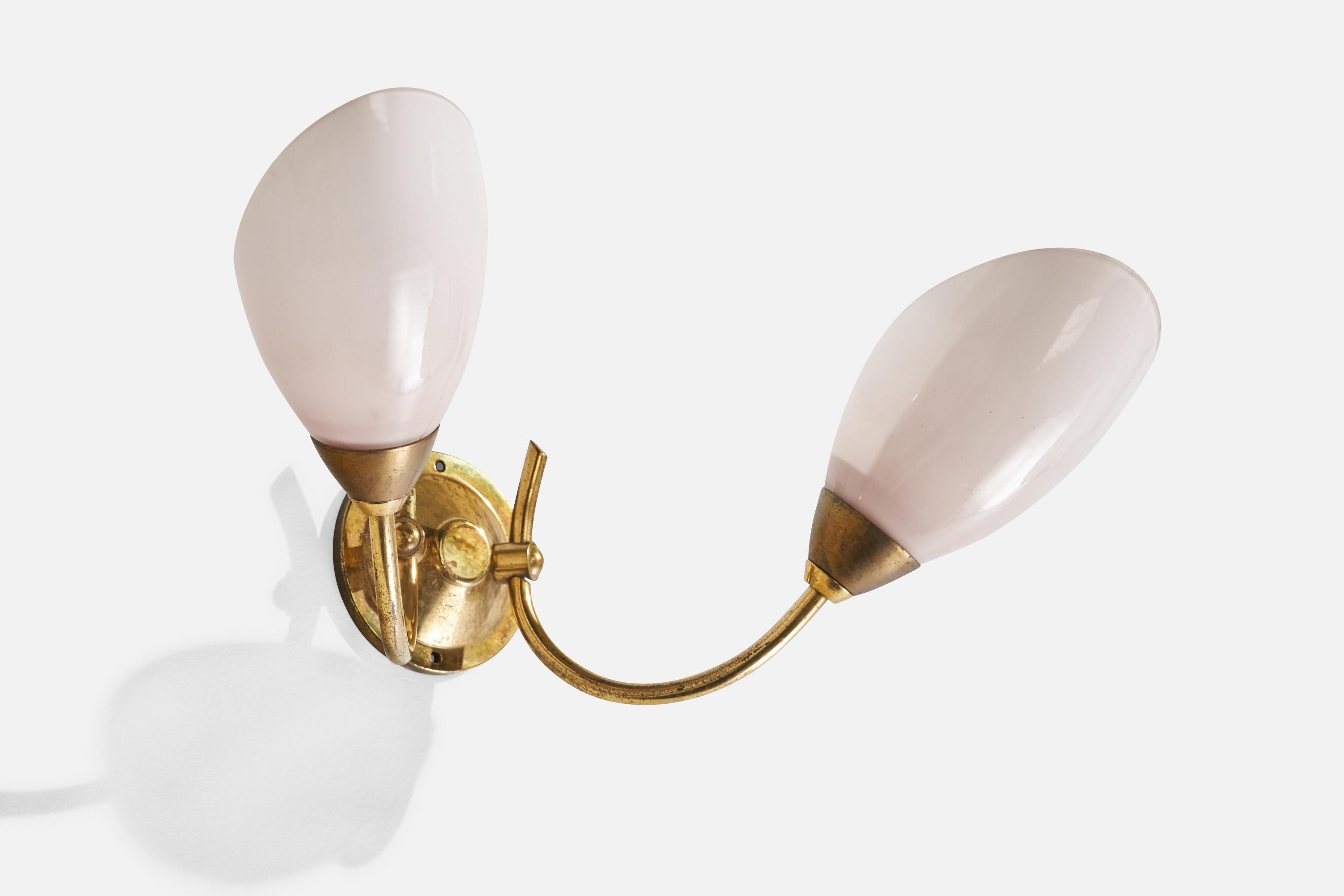 A two-armed brass and opaline glass wall light designed and produced in France, 1950s.

Overall Dimensions (inches): 5.5”H x 13” W x 8”  D
Back Plate Dimensions (inches): 2.75 H x 2.75”  W x .50” D
Bulb Specifications: E-12 Bulb
Number of Sockets: