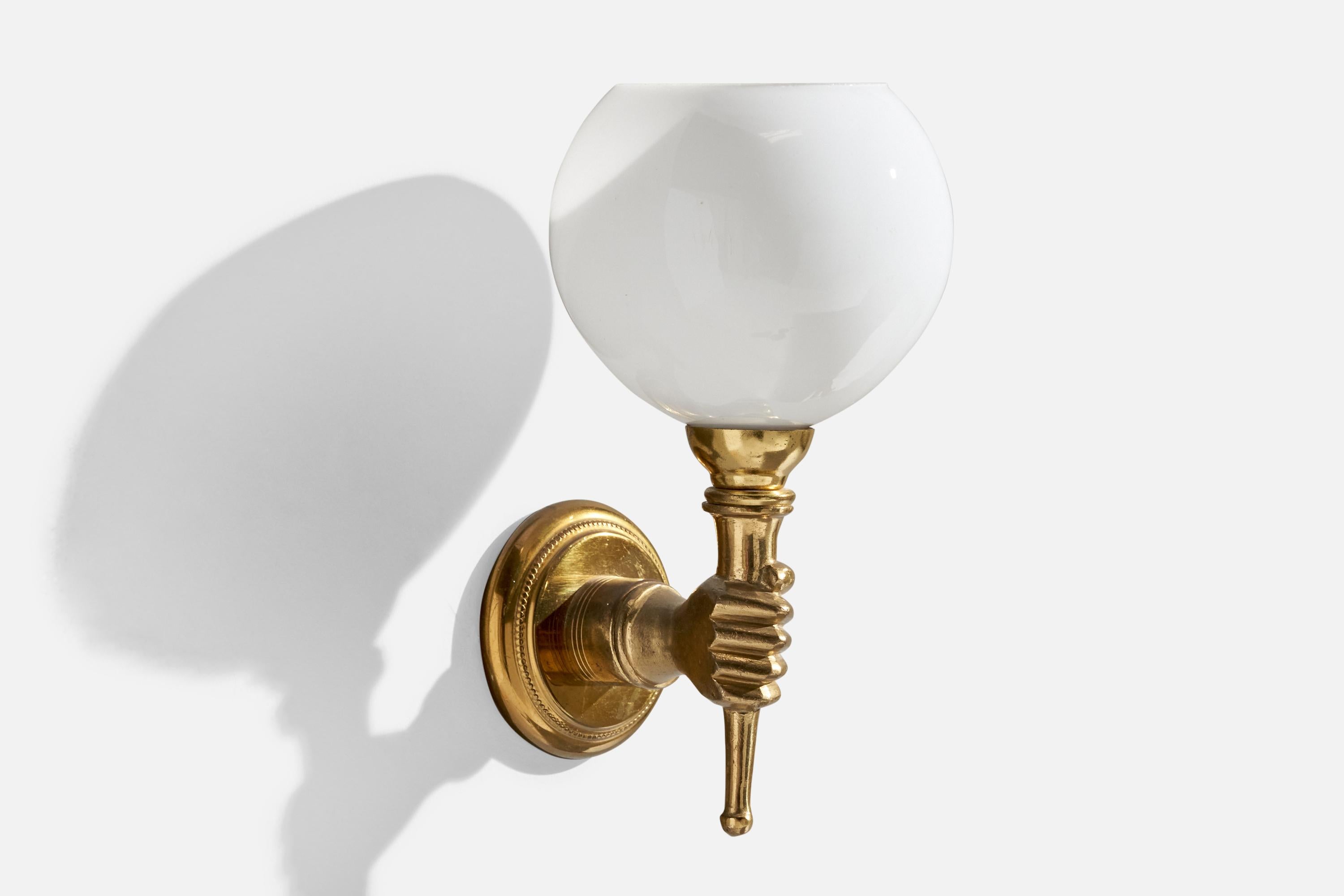 A brass and opaline glass wall light designed and produced in France, c. 1950s.

Overall Dimensions (inches):  9.75” H x 5.25” W x 6.5“D

Back Plate Dimensions (Inches):  3.25” H x 3.25” W x .75” D

Bulb Specifications: 35 mm Bayonet Bulb

Number of