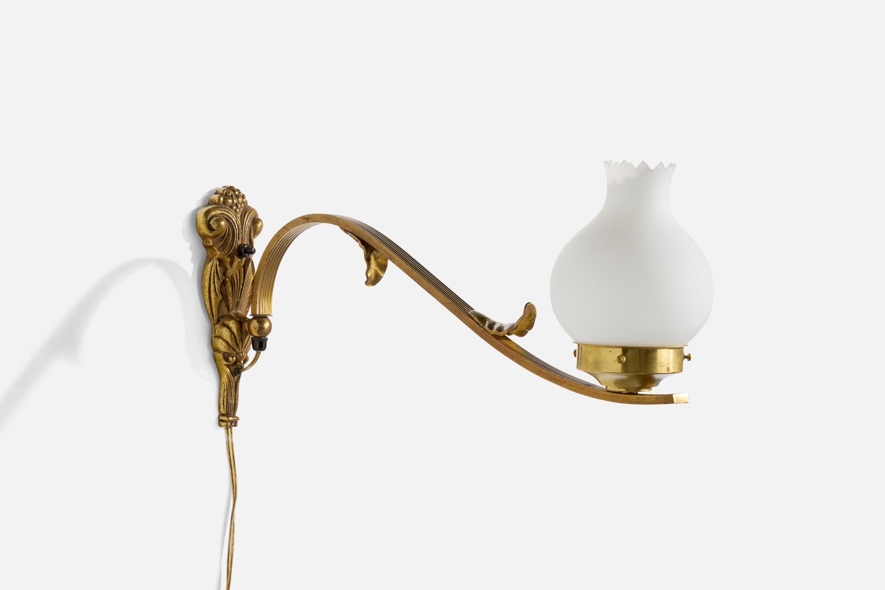 A brass and white opaline glass wall light designed and produced in France, c. 1950s.

The brass backplate and arm presents with light oxidation and staining. Replaced glass.

Overall Dimensions (Inches): 9” H x 5” W x 19.5” D

Back Plate Dimensions