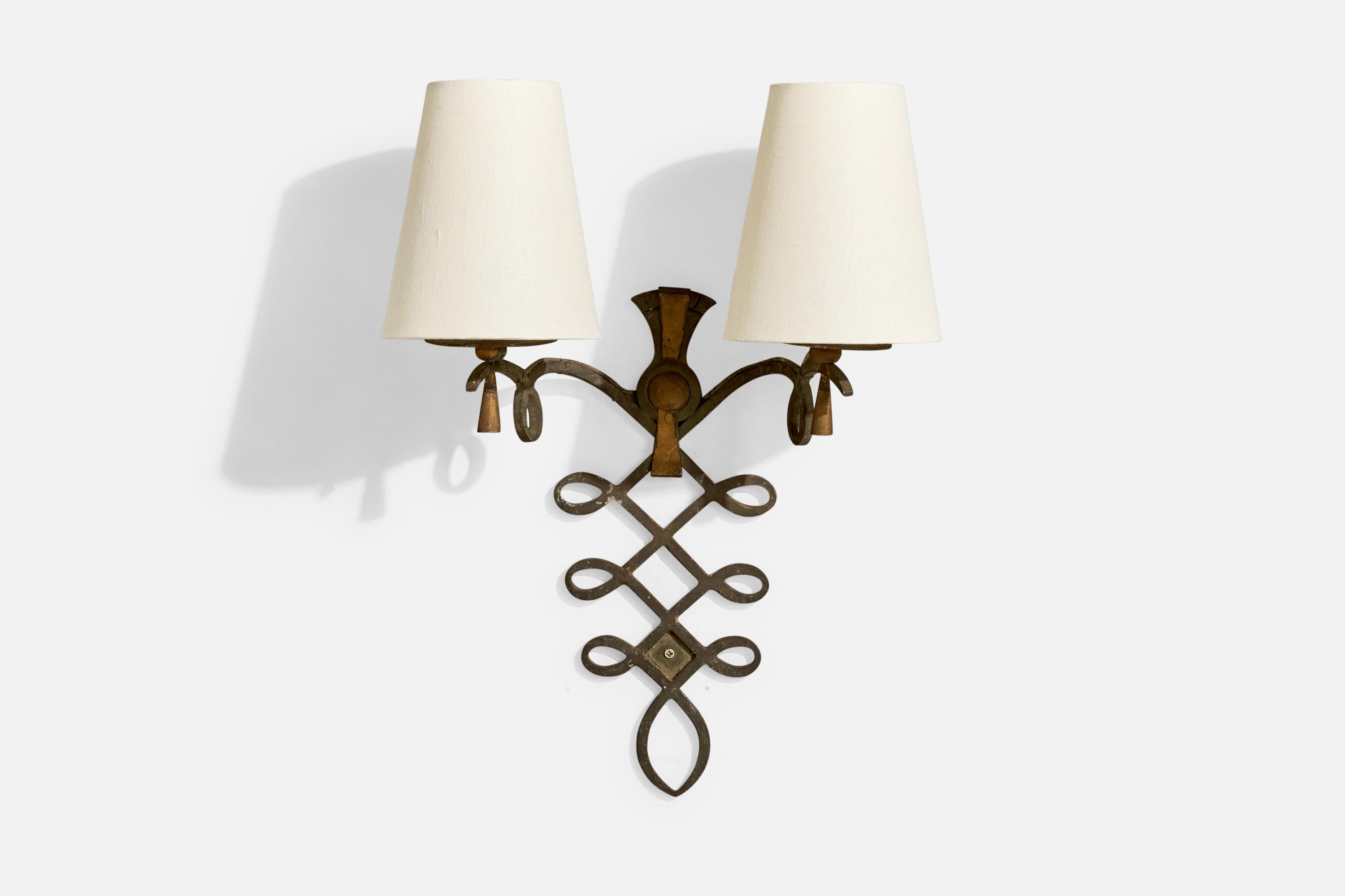 A painted iron and white fabric wall light designed and produced in France, c. 1940s.

Overall Dimensions (Inches): 18” H x 13.2” W x 6.75” D

Bulb Specifications: E-12

Number of Sockets (per fixture): 2

Does not include mounting hardware.

Sold