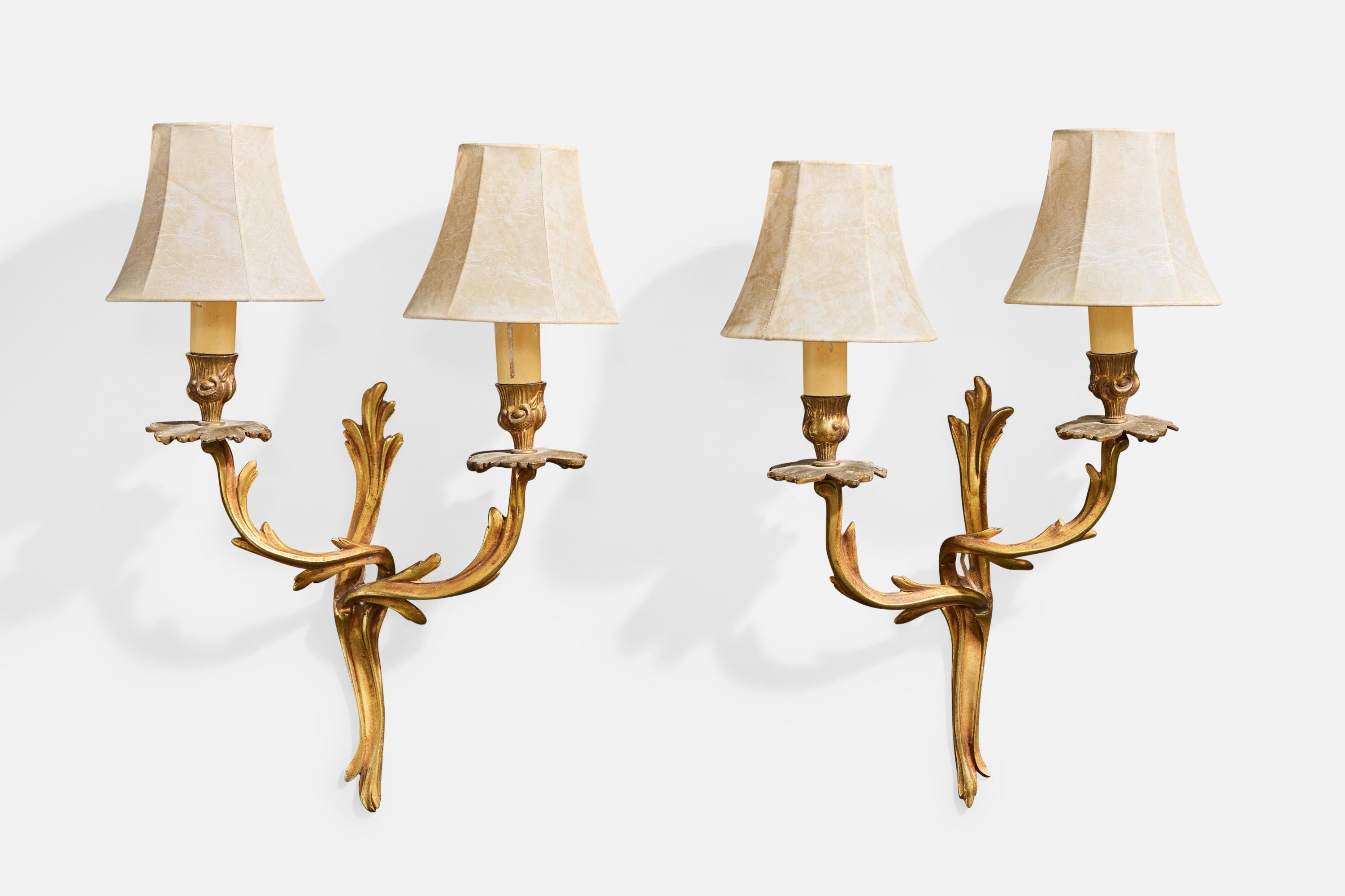 A pair of brass, bakelite, and polymer resin wall lights designed and produced in France, c. 1940s.

Replaced lampshades.

Overall Dimensions (Inches): 17.0