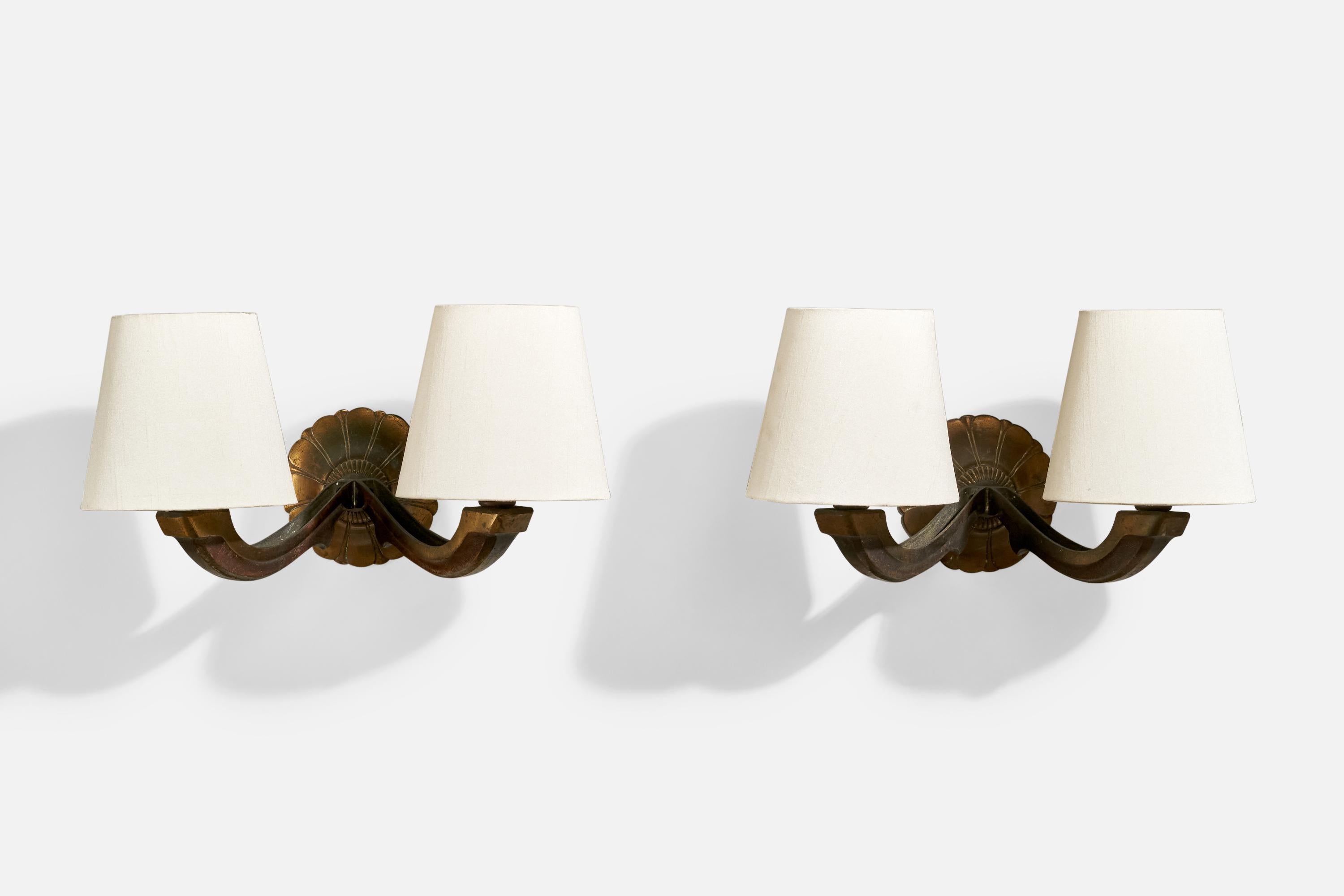 A pair of brass and fabric wall lights designed and produced in France, c. 1930s.

Overall Dimensions (Inches): 8” H x 15” W x 10” D

Back Plate Dimensions (Inches): 5” H x 5” W x 2” D

Bulb Specifications: E-12 

Number of Sockets (per fixture):