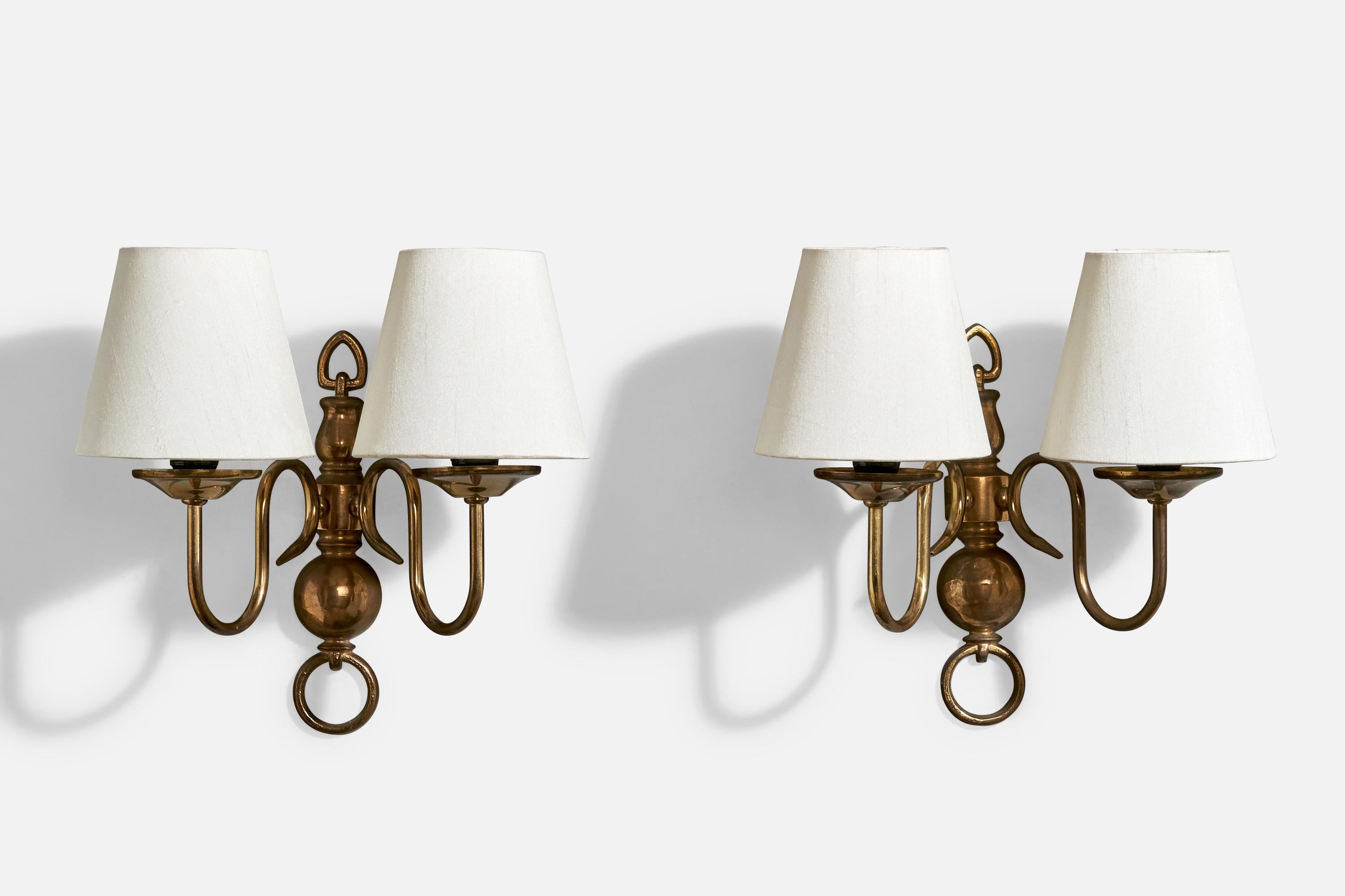 A pair of brass and white fabric wall lights designed and produced in France, c. 1950s.

Overall Dimensions (Inches): 11.25” H x 11” W x 7.3“ D

Back Plate Dimensions (Inches): 9.25” H x 2” W x .75” D

Bulb Specifications: E-12 candle 

Number of