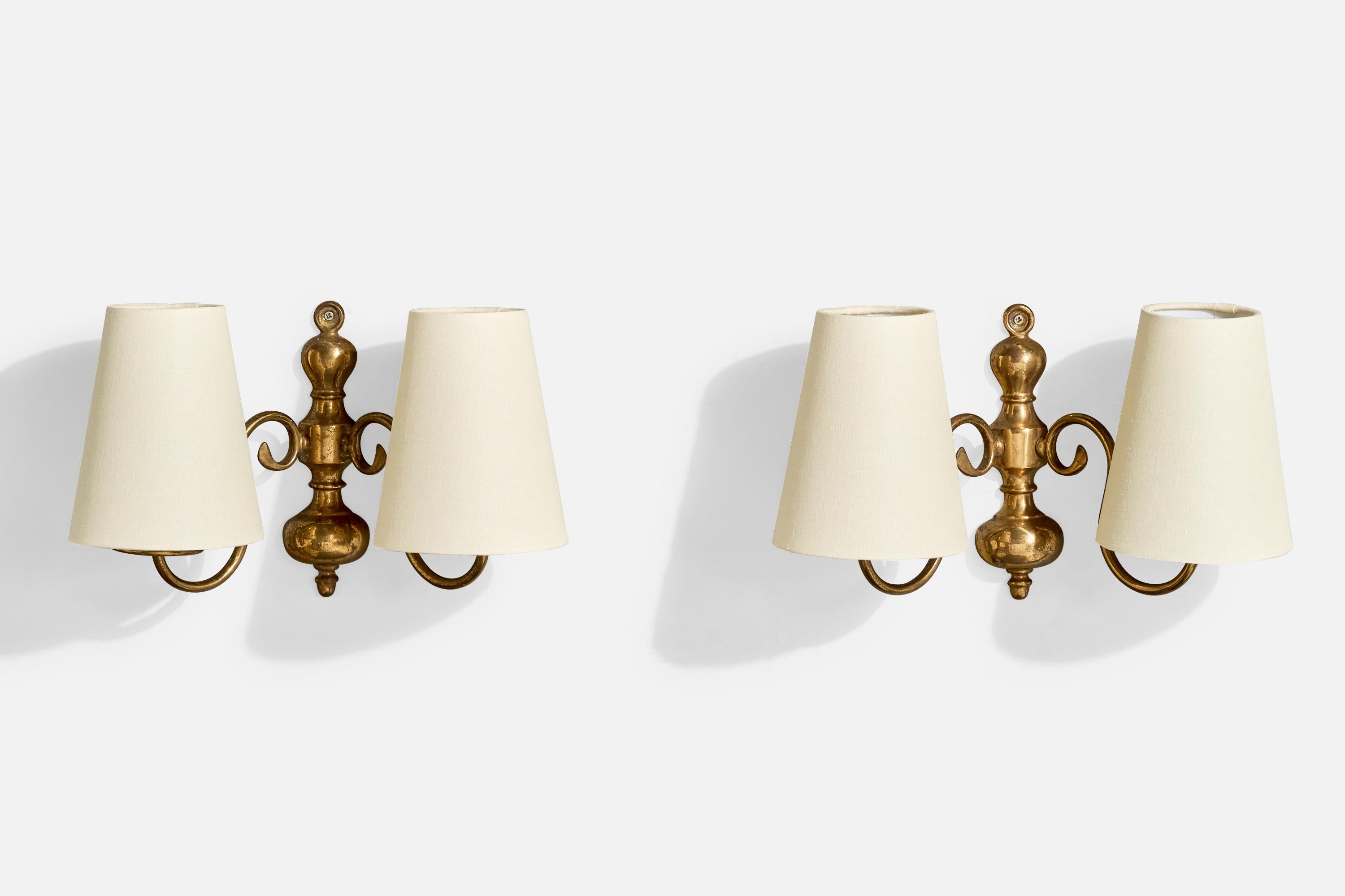 A pair of brass and white fabric wall lights designed and produced in France, c. 1960s.

Overall Dimensions (Inches): 8.25” H x 13” W x 6.75“ D

Back Plate Dimensions (Inches): 7.75” H x 2.25“ W x .75” D

Bulb Specifications: E-12

Number of Sockets