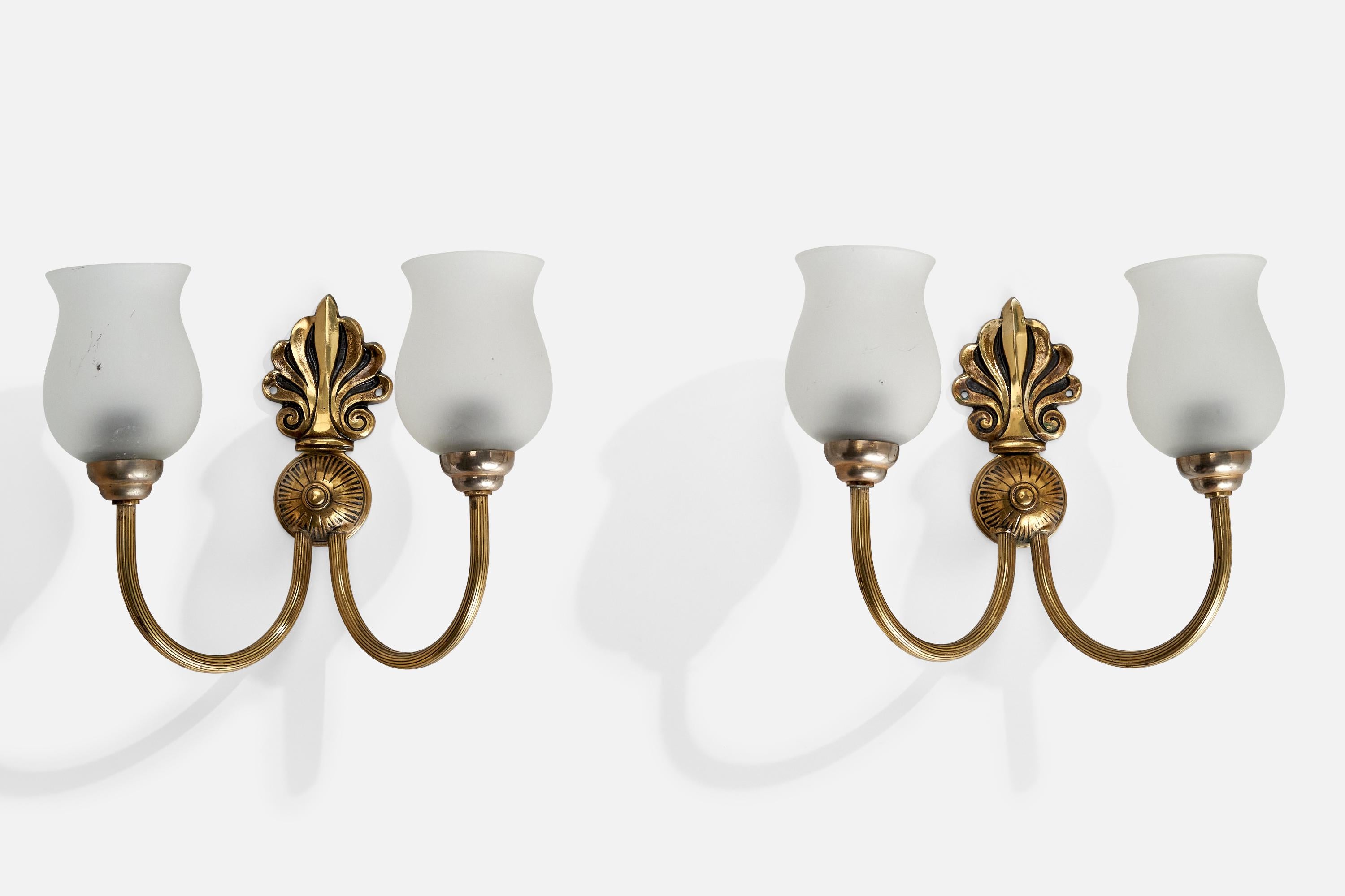 A pair of brass and frosted glass wall lights designed and produced in France, 1950s.

Overall Dimensions (inches): 8.5
