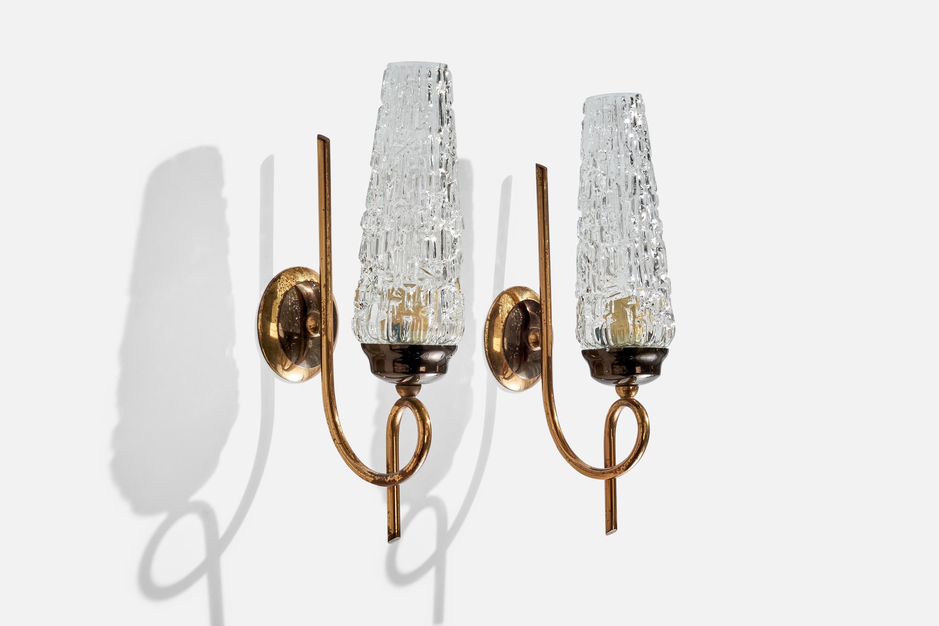 A pair of brass and glass wall lights designed and produced in France, c. 1950s.

Overall Dimensions (inches): 11.125 ” H x 2.75” W x  4.75“D

Back Plate Dimensions (Inches):  2.75” H x 2.75” W x .625” D

Bulb Specifications: E-14 Bulbs

Number of