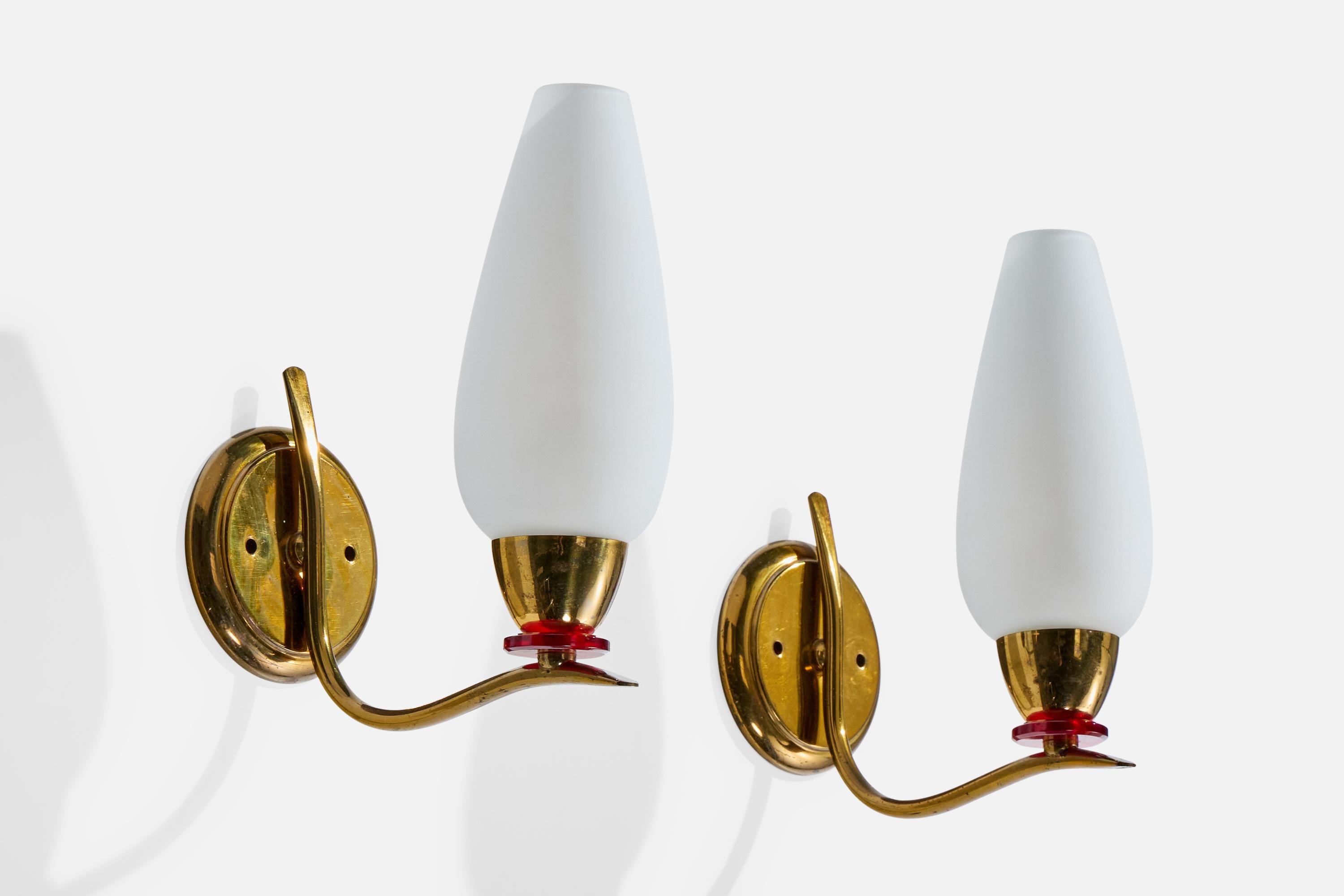 A pair of brass, red-colored and white opaline glass wall lights likely designed and produced in France, c. 1950s.

Overall Dimensions (Inches): 8.5