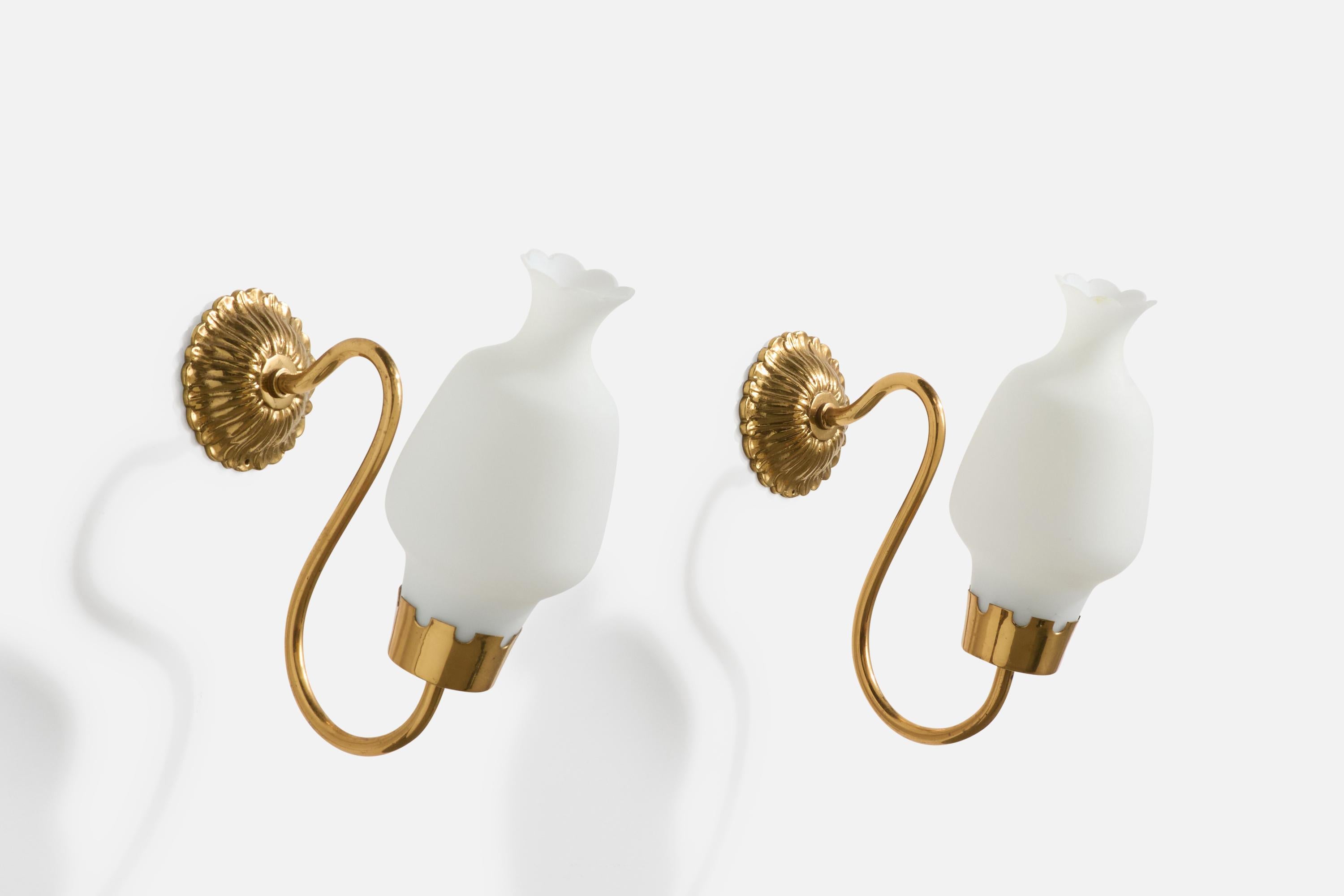 A pair of brass and white opaline glass wall lights designed and produced in France, c. 1960s.

The brass arms present with very light oxidation.

Overall Dimensions (Inches): 10” H x 4” W x 8.75“ D

Back Plate Dimensions (Inches): 3.3” H x 3.3“ W x