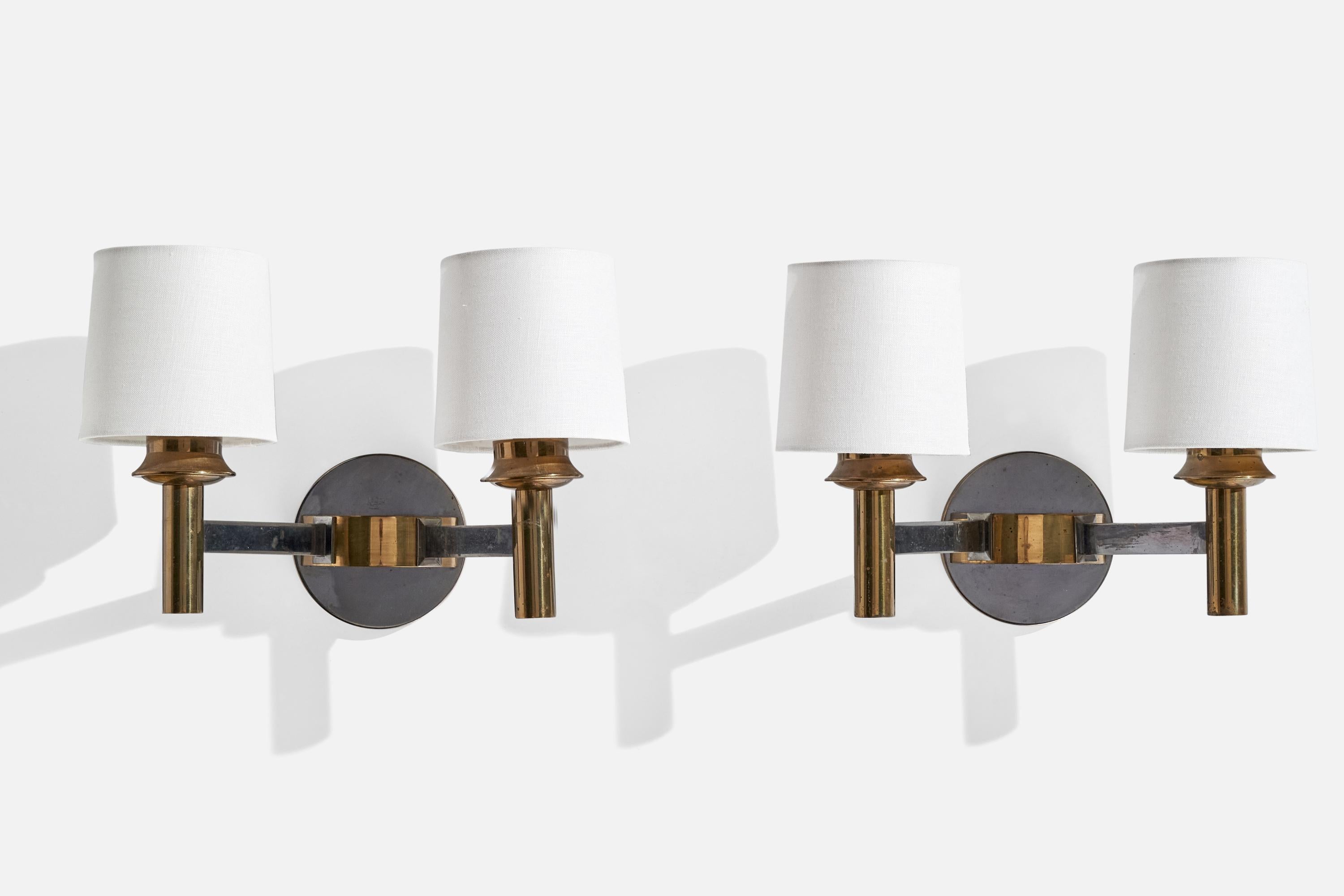 A pair of brass, metal and white fabric wall lights designed and produced in France, c. 1950s.

Overall Dimensions (inches):  8.125” H x  12.375” W x 7.5 “D
Back Plate Dimensions (Inches):  4.5” H x 4.5” W x 2” D
Bulb Specifications: E-14