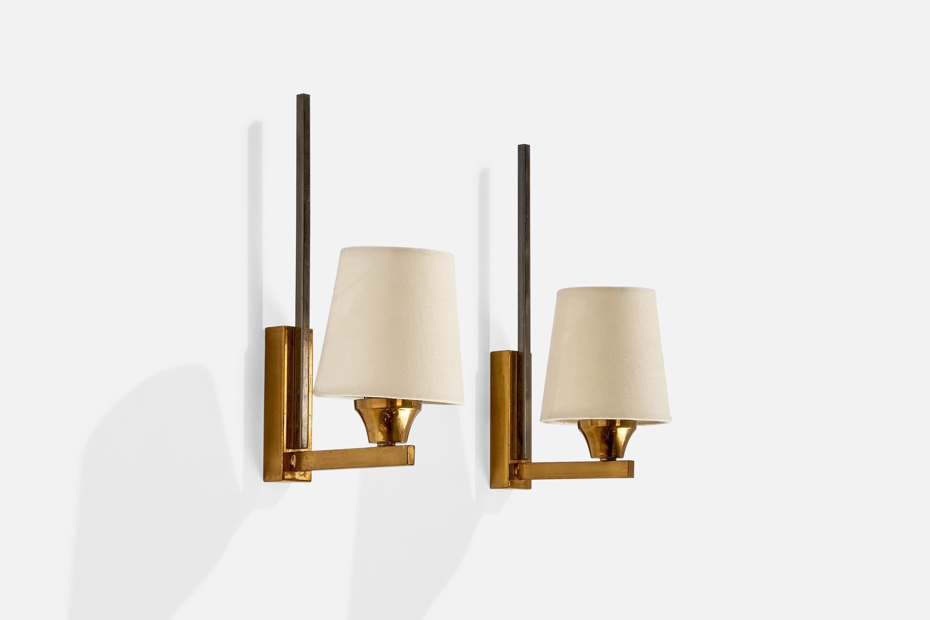 A pair of brass, metal, and white fabric wall lights designed and produced in France, c. 1950s.

Overall Dimensions (inches):  11.25” H x  4.125” W x  6.5“D
Back Plate Dimensions (Inches):  4.375” H x 1.25” W x .875” D
Bulb Specifications: E-12
