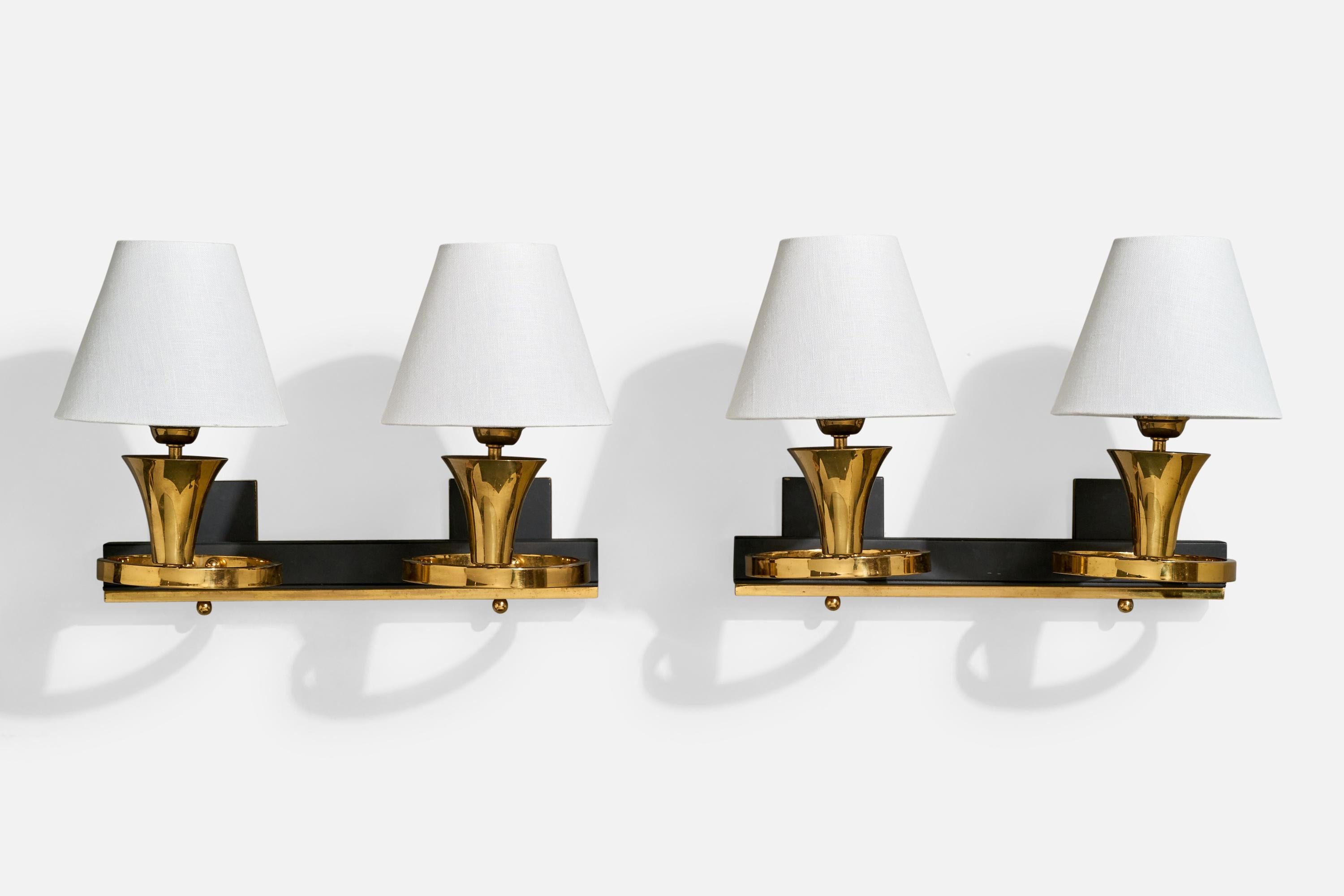 A pair of brass, black-lacquered metal and white fabric wall lights designed and produced in France, c. 1950s.

Overall Dimensions (inches): 10.5” H x 15” W x 9.5“ D

Back Plate Dimensions (Inches): 3” H x 3” W x .3” D (each fixture has 2 back
