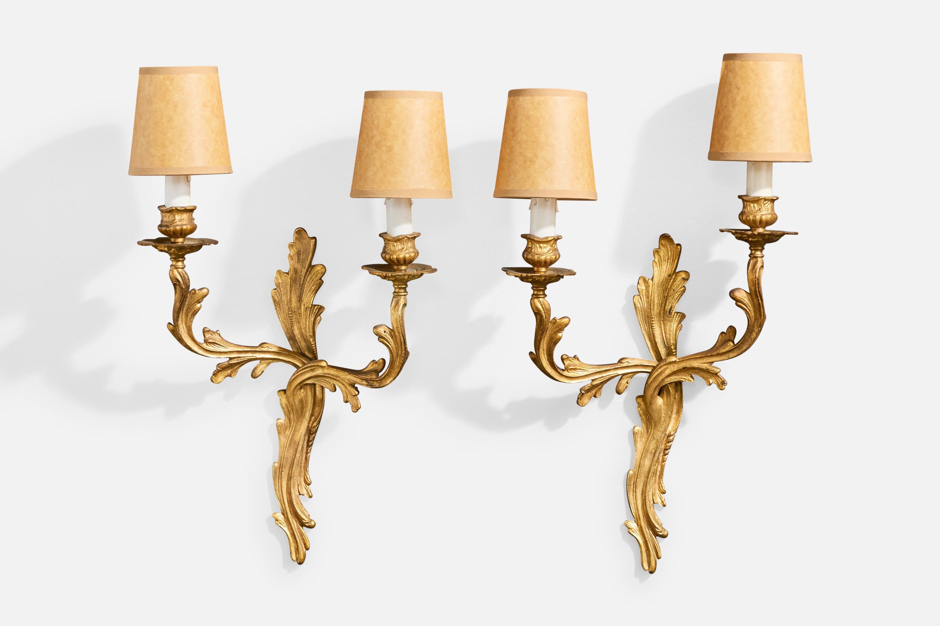 A pair of brass, white plastic and brown parchment paper wall lights designed and produced in France, c. 1950s.

Brass presents with moderate oxidation throughout. 

Brand new lampshades.

Overall Dimensions (Inches): 21.0