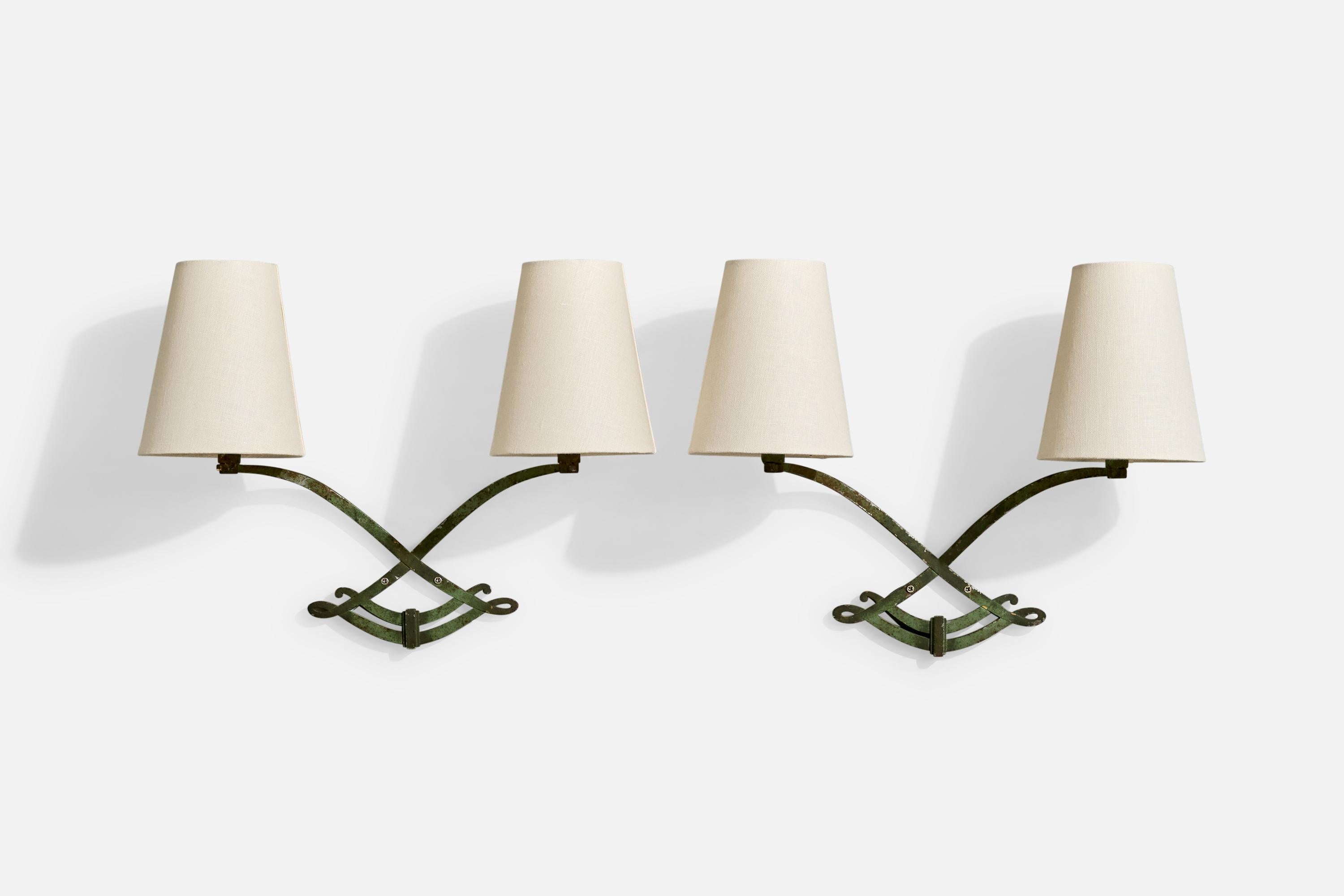 A pair of green-painted iron, brass and white fabric wall lights designed and produced in France, c. 1940s.

Overall Dimensions (Inches): 13” H x 15.75” W x 6.5“ D

Back Plate Dimensions (Inches): No backplate, just two holes to drill through

Bulb