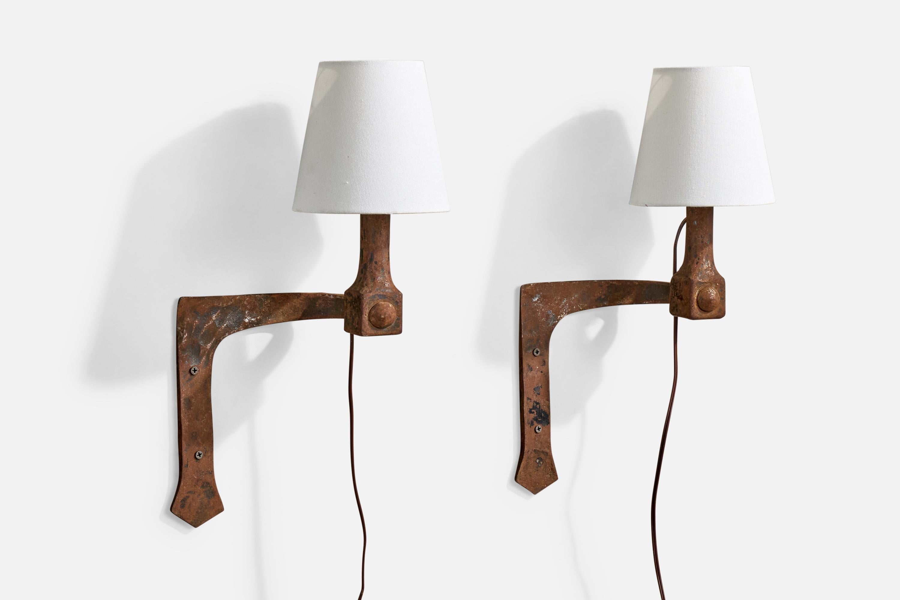 A pair of iron and white fabric wall lights designed and produced in France, c. 1940s.

Brand new fabric shades.

Overall Dimensions (Inches): 17.75” H x 9” W x 7“ D

Back Plate Dimensions (Inches): No backplate, just two holes to drill