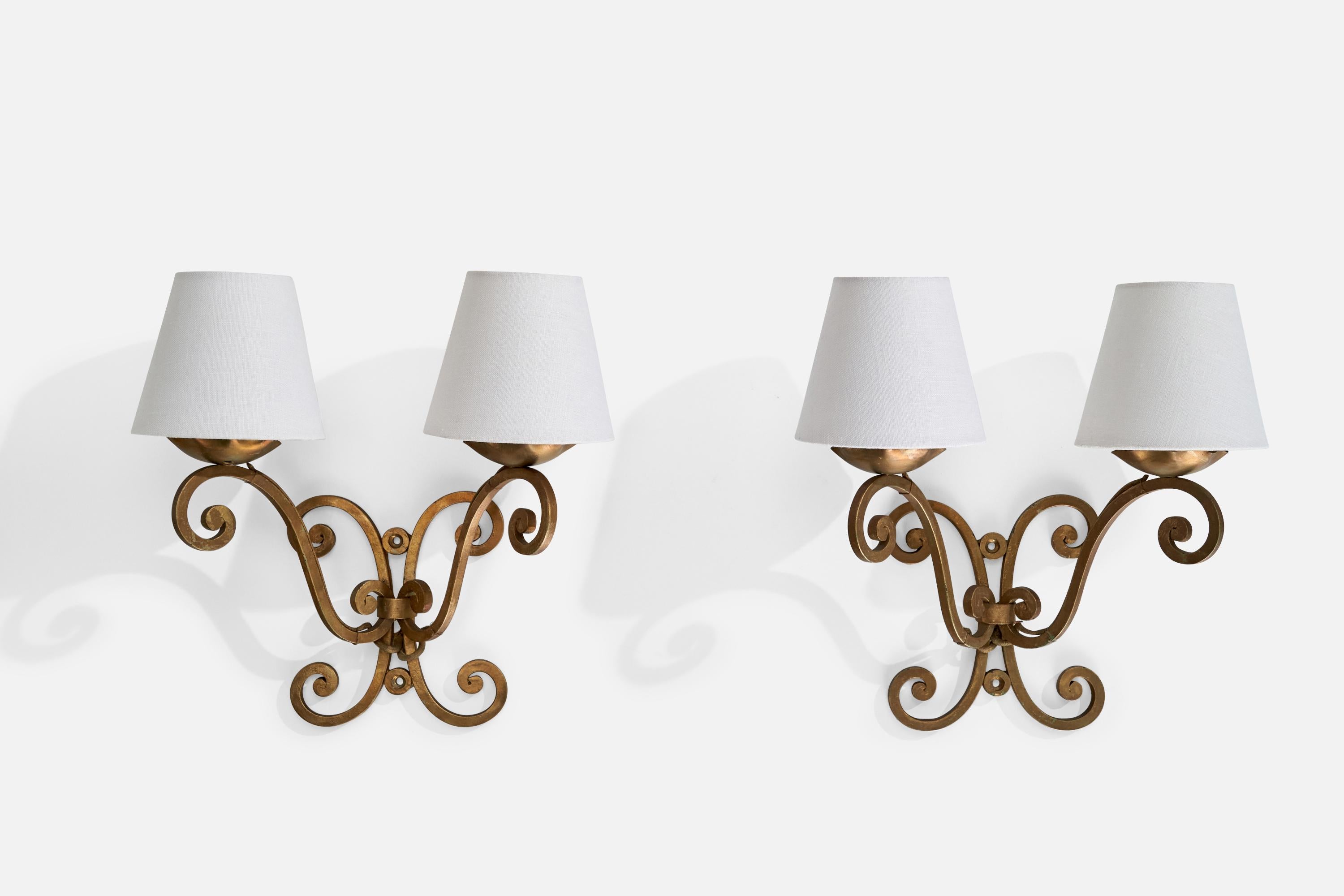 A pair of gold-painted metal and white fabric wall lights designed and produced in France, c. 1940s.

Overall Dimensions (inches): 13.5