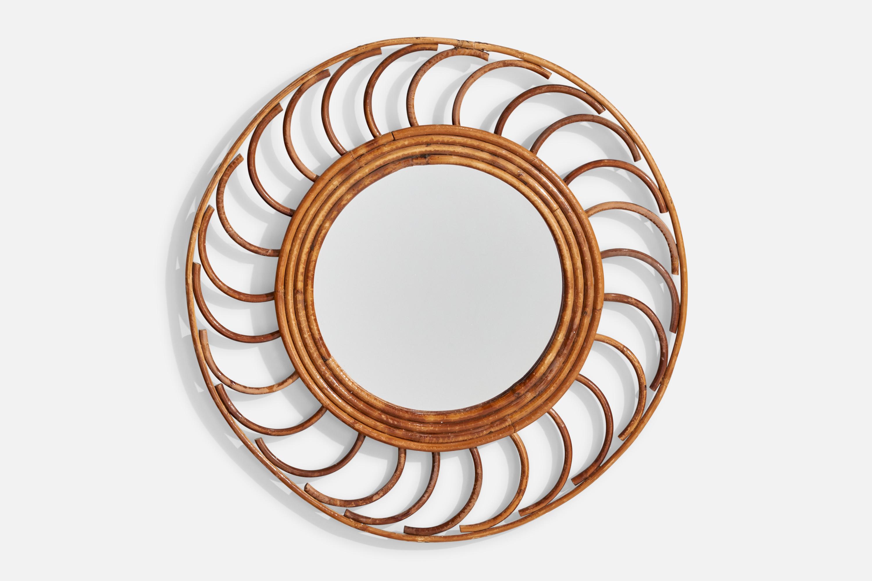 A rattan wall mirror designed and produced in France, c. 1960s.

Dimensions: 18.5” H x 18.5” W x .875” D