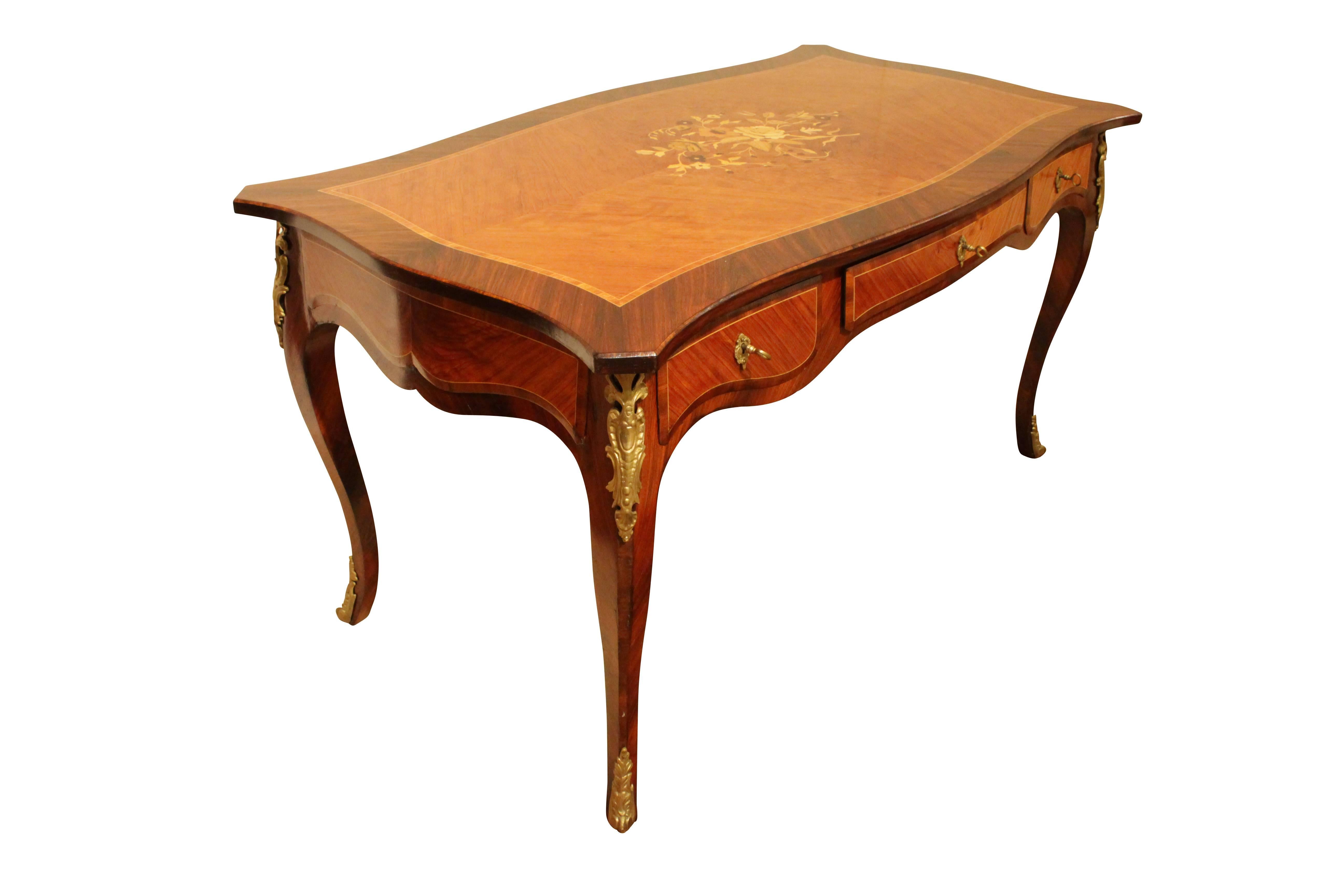 Very nice desk in Louis XV style with great marquetry. The French Bureau can be centered. The desk is equipped with three drawers. The desk was made circa 1900.