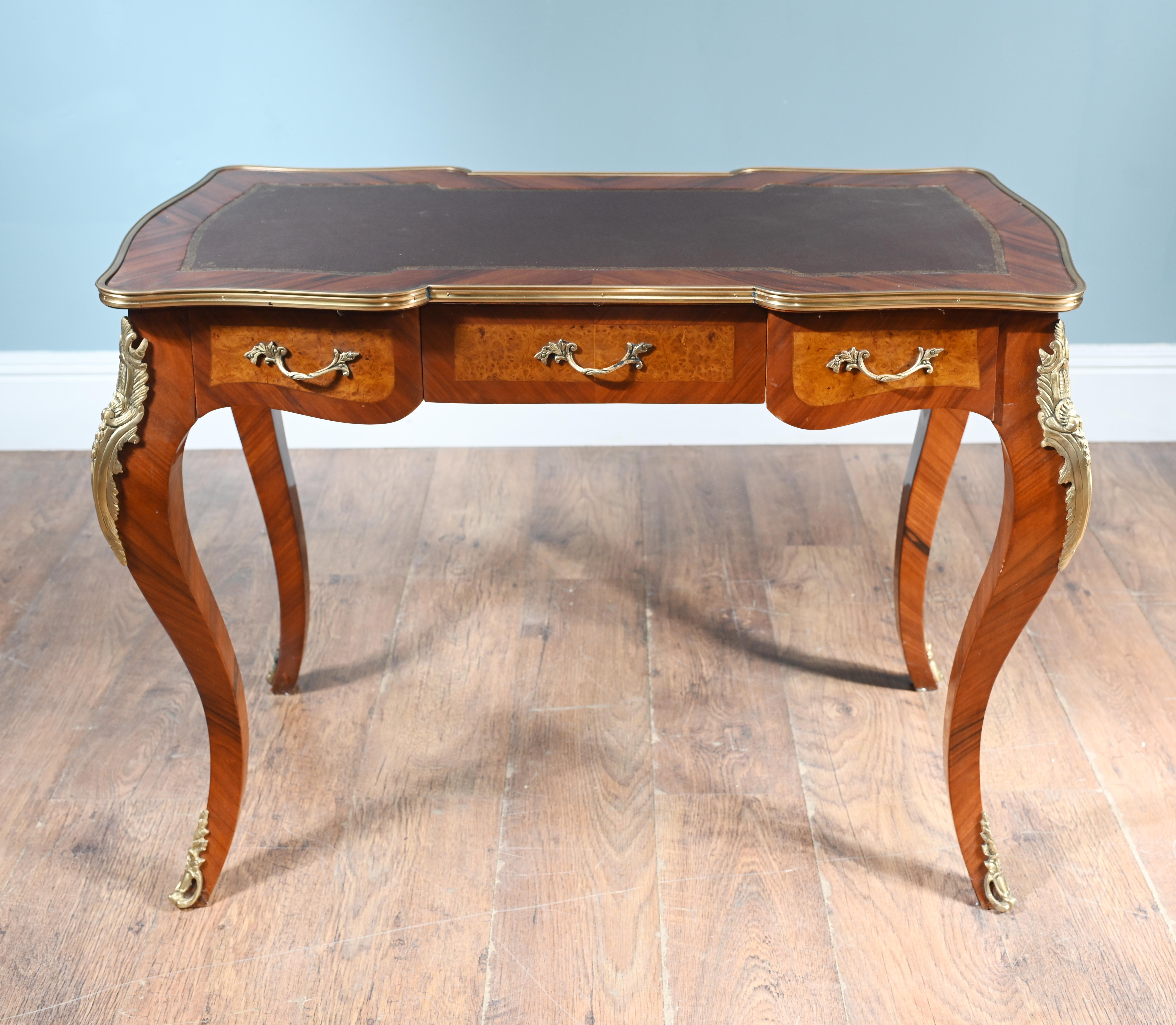 Cool French bureau plat or desk in the Empire manner
Elegant piece with cabriole legs and crafted from kingwood
Original ormolu fittings and top is finished in tooled leather
Bought from a dealer on the Marche Biron at Paris antiques markets
Offered