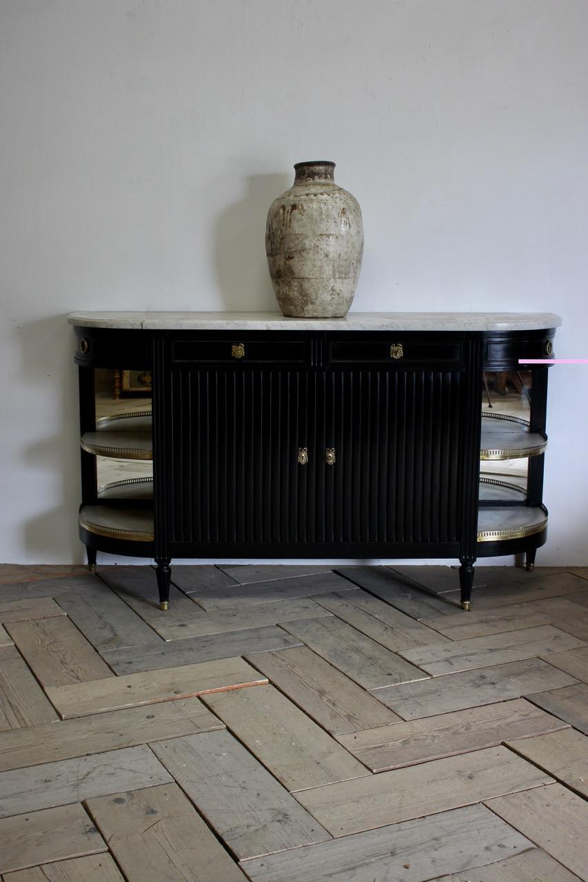 A very smart and practical, circa 1920s, French, ebonised dessert console table, of great proportions retaining the original brass mounts and gallery and the Carrara marble, with oak linings, and the original Mercier frerès label. Paris This elegant
