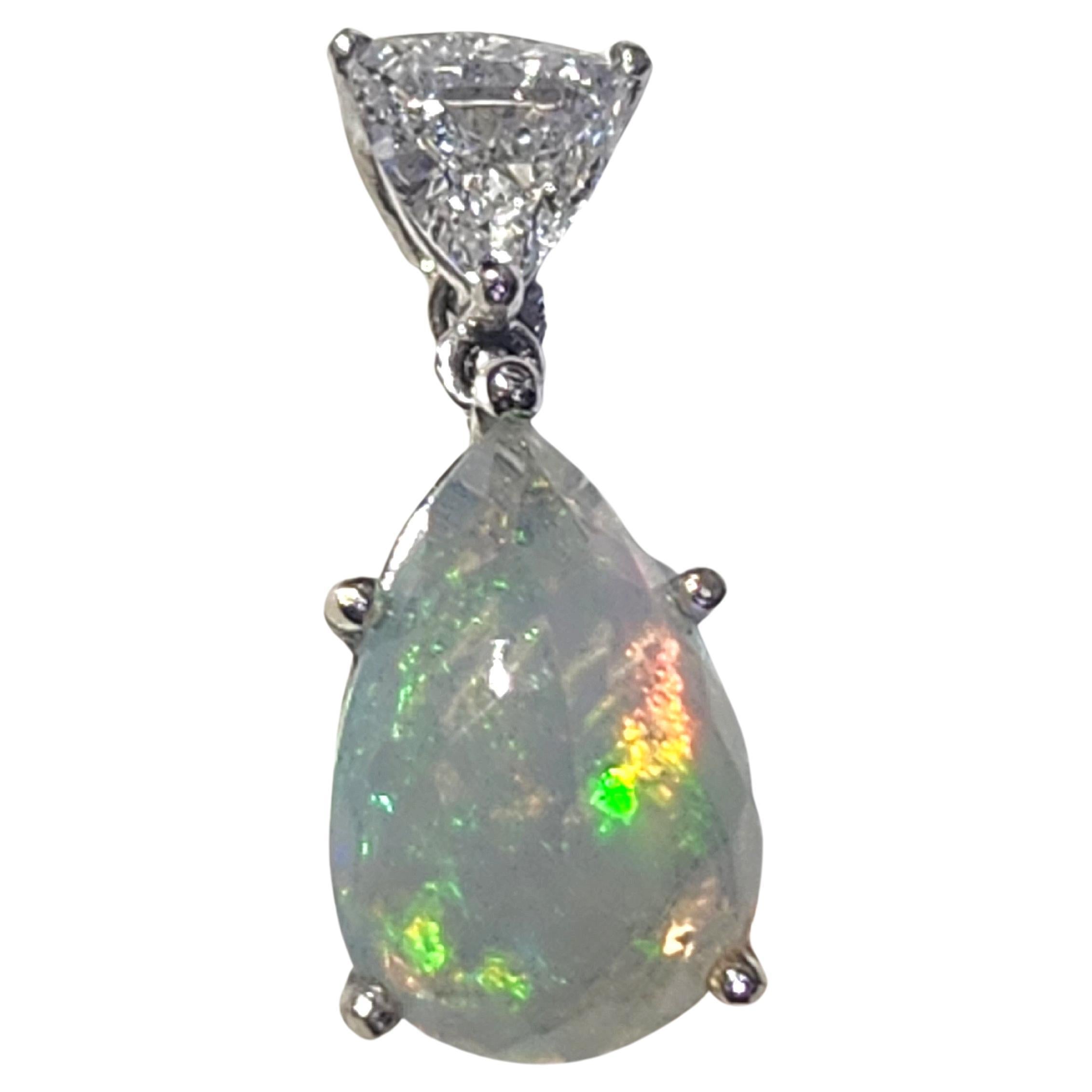 Natural fire opal stone pendant in 18k white gold topped with triangular brilliant cut Diamond F color white si clearity 0.65 carats weight GIA certified pendant made in france hall marked with eagle head french assay mark 