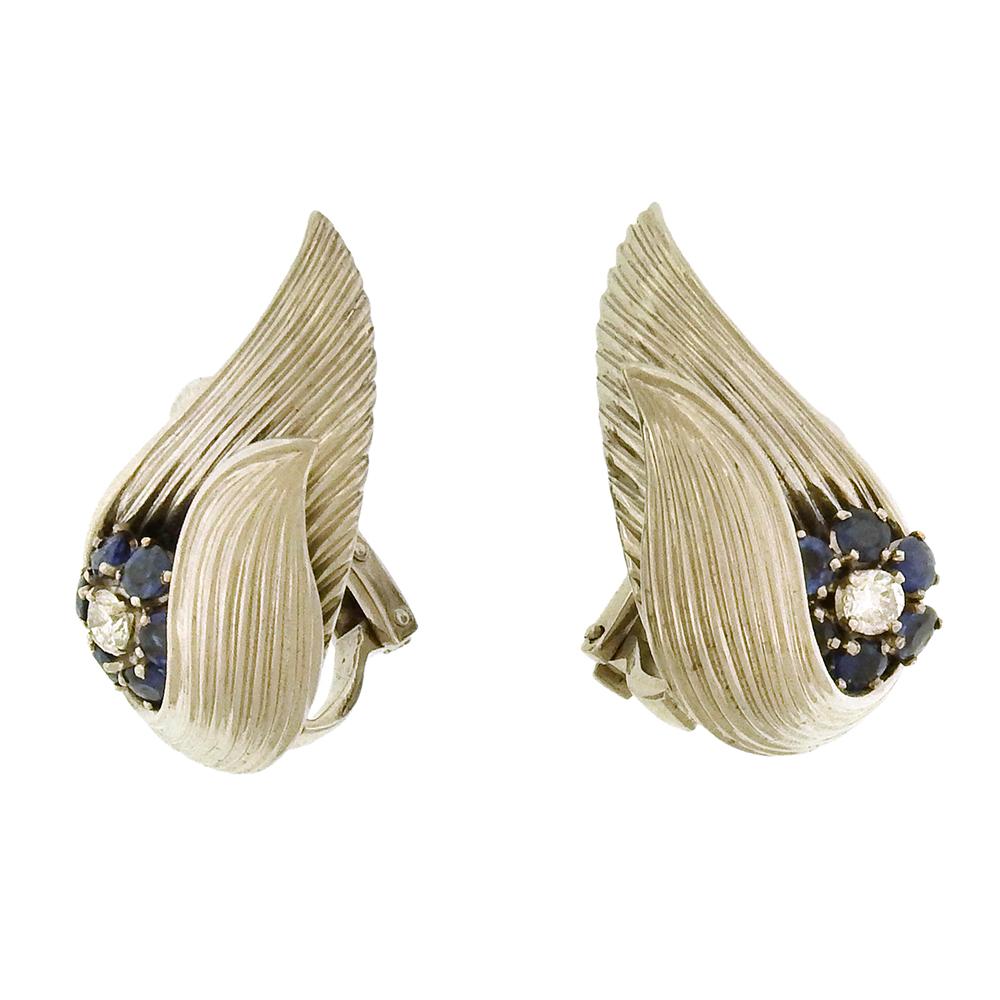 Diamond, sapphire and 18K white gold winged French-made clip on earrings, circa 1960's, are perfectly soignee in the French manner.  Earrings measure 1-1/8