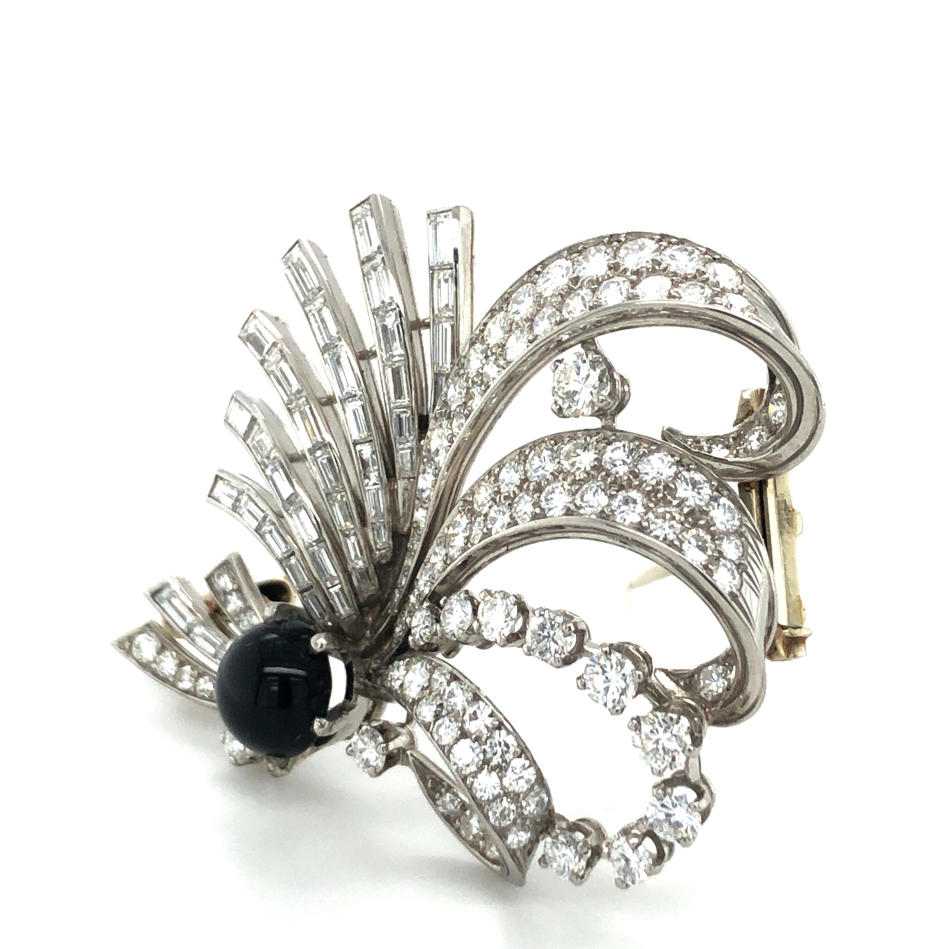 The designer of this brooch might have thought of those wonderfully curved ostrich feathers at least it reminds me of it. A very extravagant combination of different setting techniques and diamond cuts creates the lightness of this jewel. 39