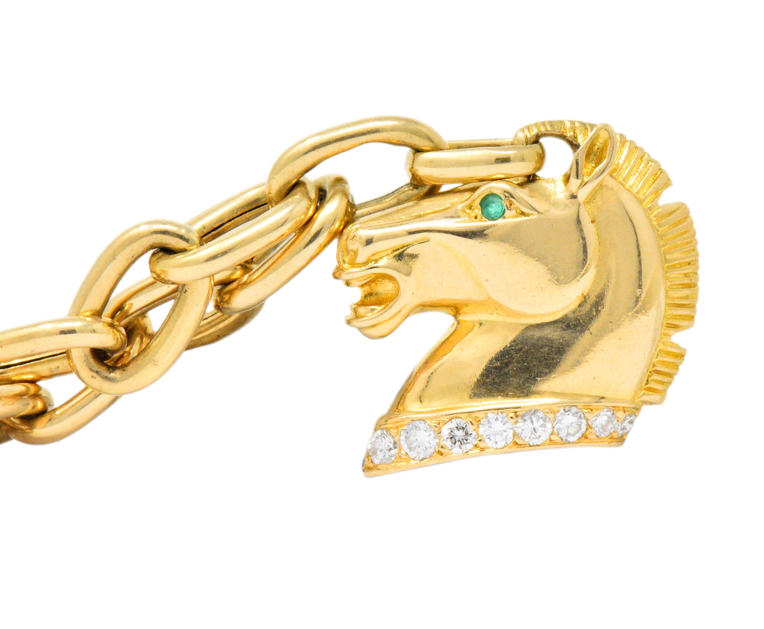 With three polished and engraved gold horse head charms

One accented with round brilliant cut diamonds weighing approximately 0.25 carat total, G/H color and VS to SI clarity

Two horses with tiny round cut ruby eyes, one with a tiny round cut