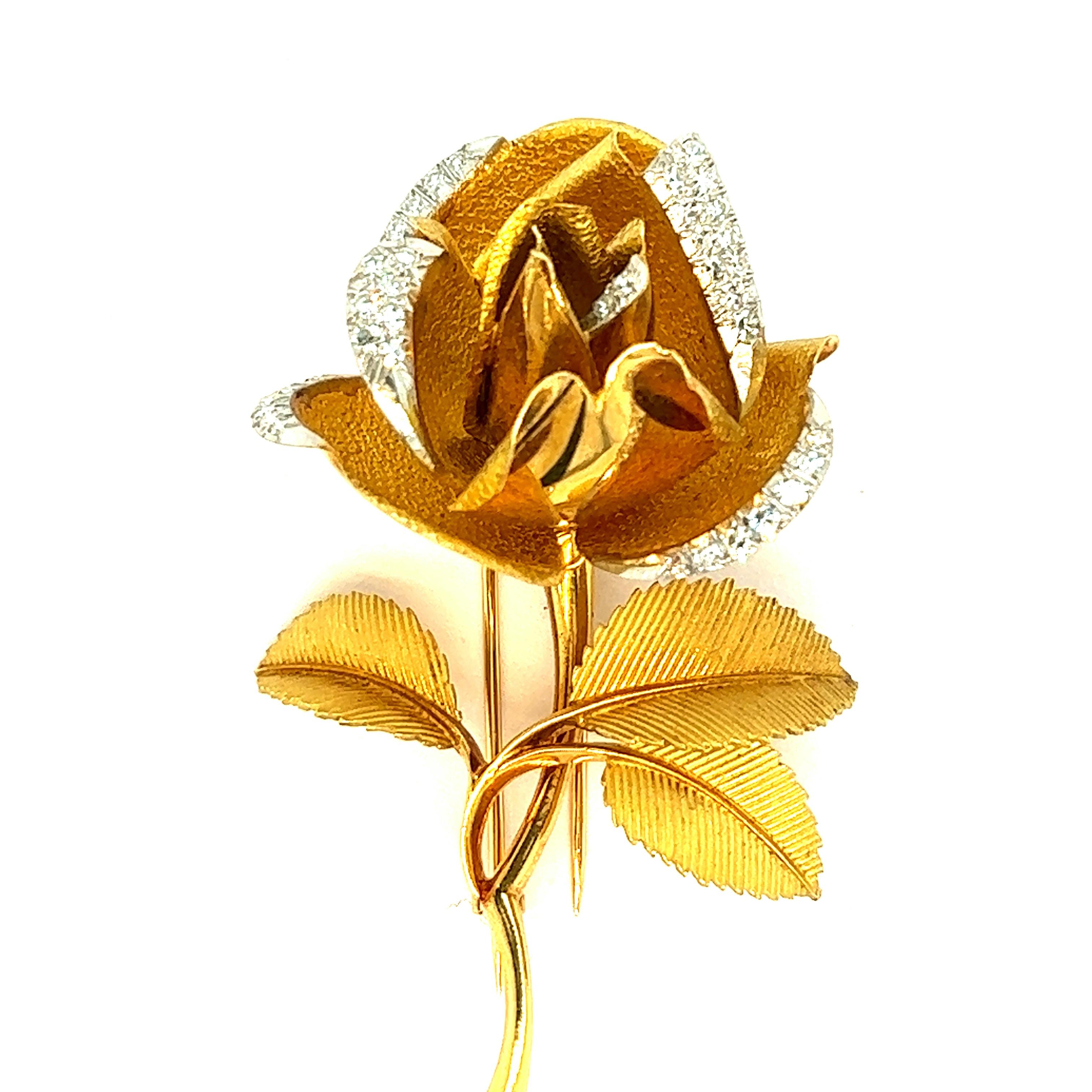 French diamond gold rose brooch, circa 1970s

Very fine and beautiful workmanship done in this brooch made out of round-cut diamonds, 18 karat yellow gold, with a rose flower motif; marked Made in France, OR 18 cts

Size: width 1.56 inches, length