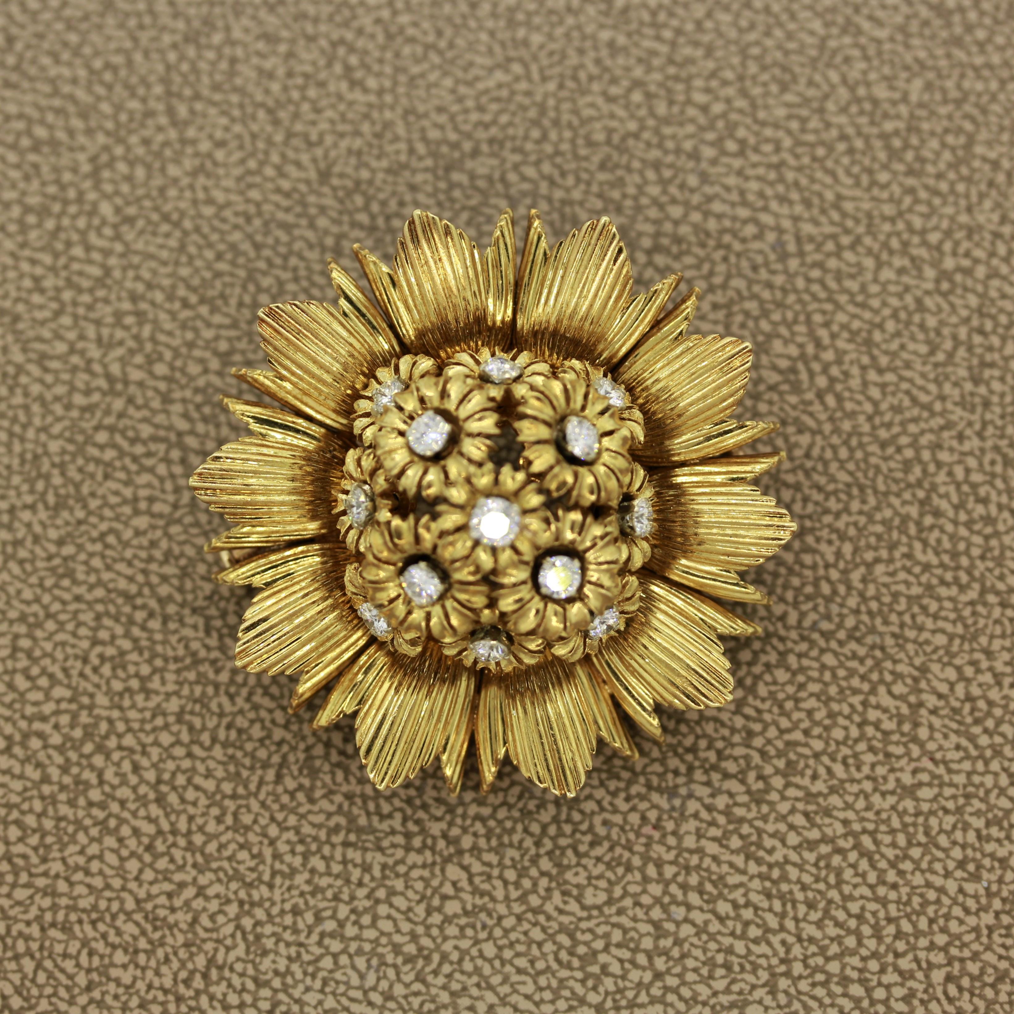 A special brooch made in France of a blossomed sunflower. It features 1.50 carats of round cut diamonds set in the center of each flower. Made in the classic French style, each flower in the center moves and dances independently of each other. Hand