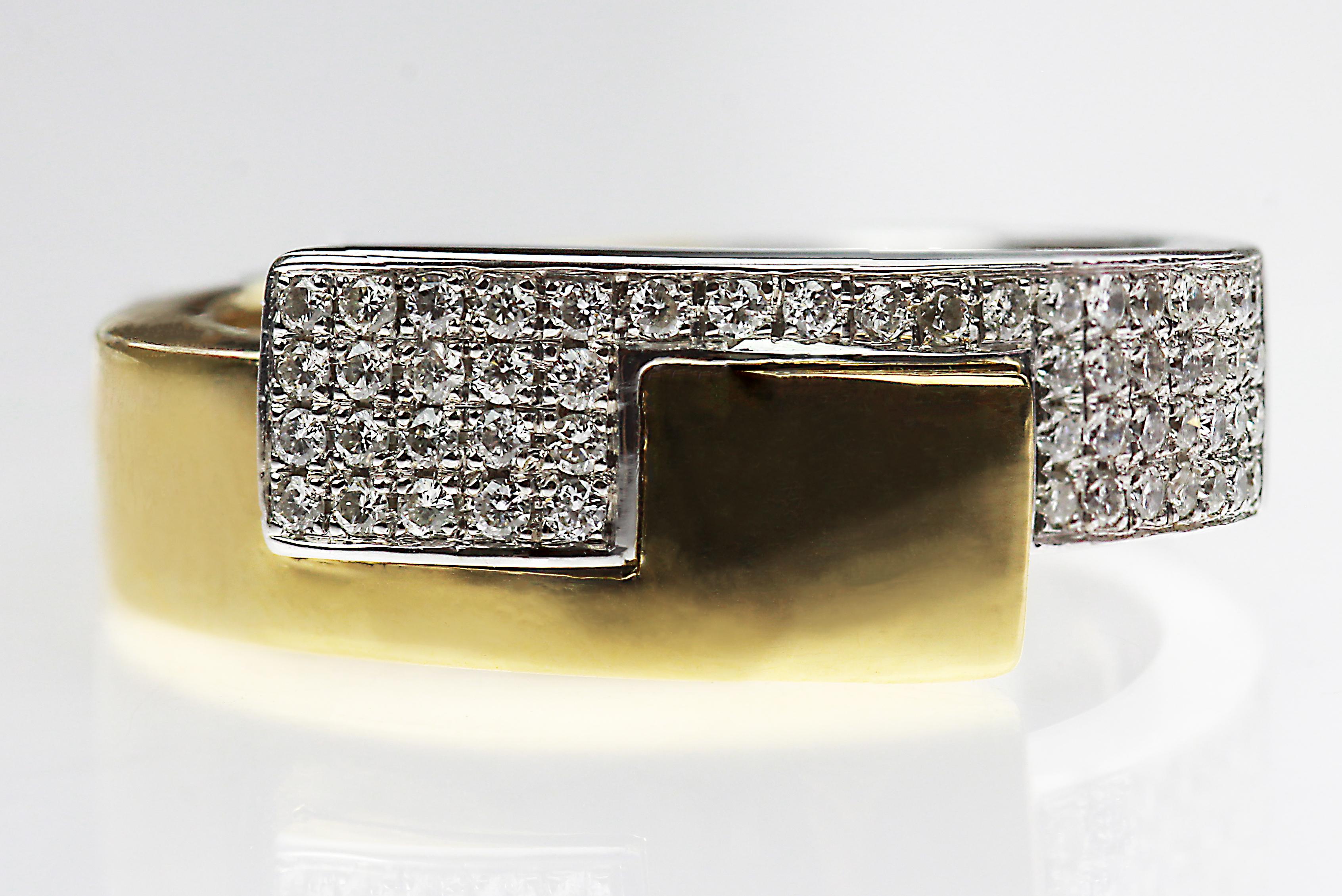 A truly stunning piece, this is a diamond, white gold and yellow gold ring.  White gold and yellow gold, effortlessly interlocking with one another in harmony and realign seamlessly at the back causing a mystical blend of the two colours. Well and