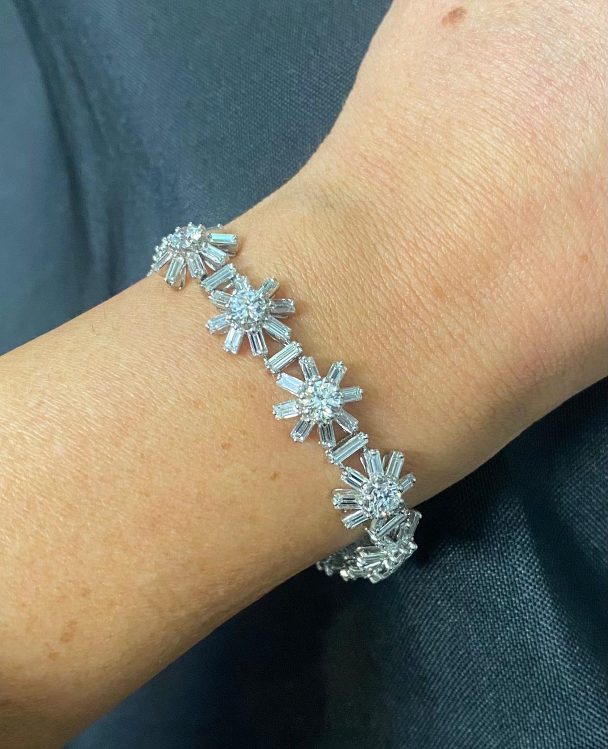 French Diamond Snowflake Bracelet   

An 18-karat white gold snowflake motif bracelet set with round and baguette cut diamonds. 

Approximate diamond weight: 12.05 carats
Metal Type: 18 Karat Gold 
Approximate Measurements: 7